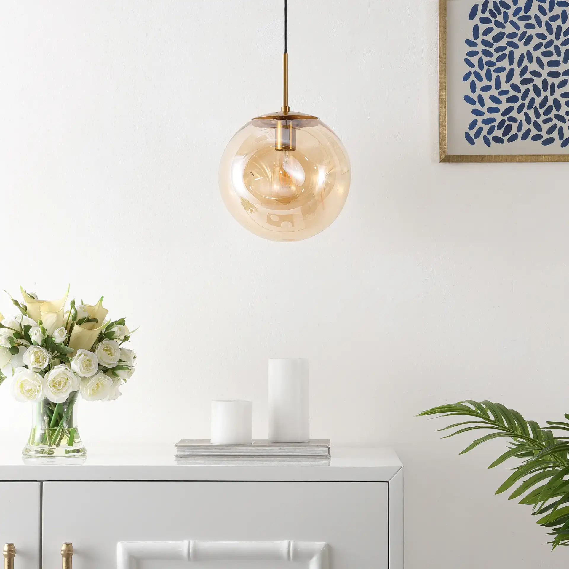 Cyril Pendant in Amber / Brass in a styled room
