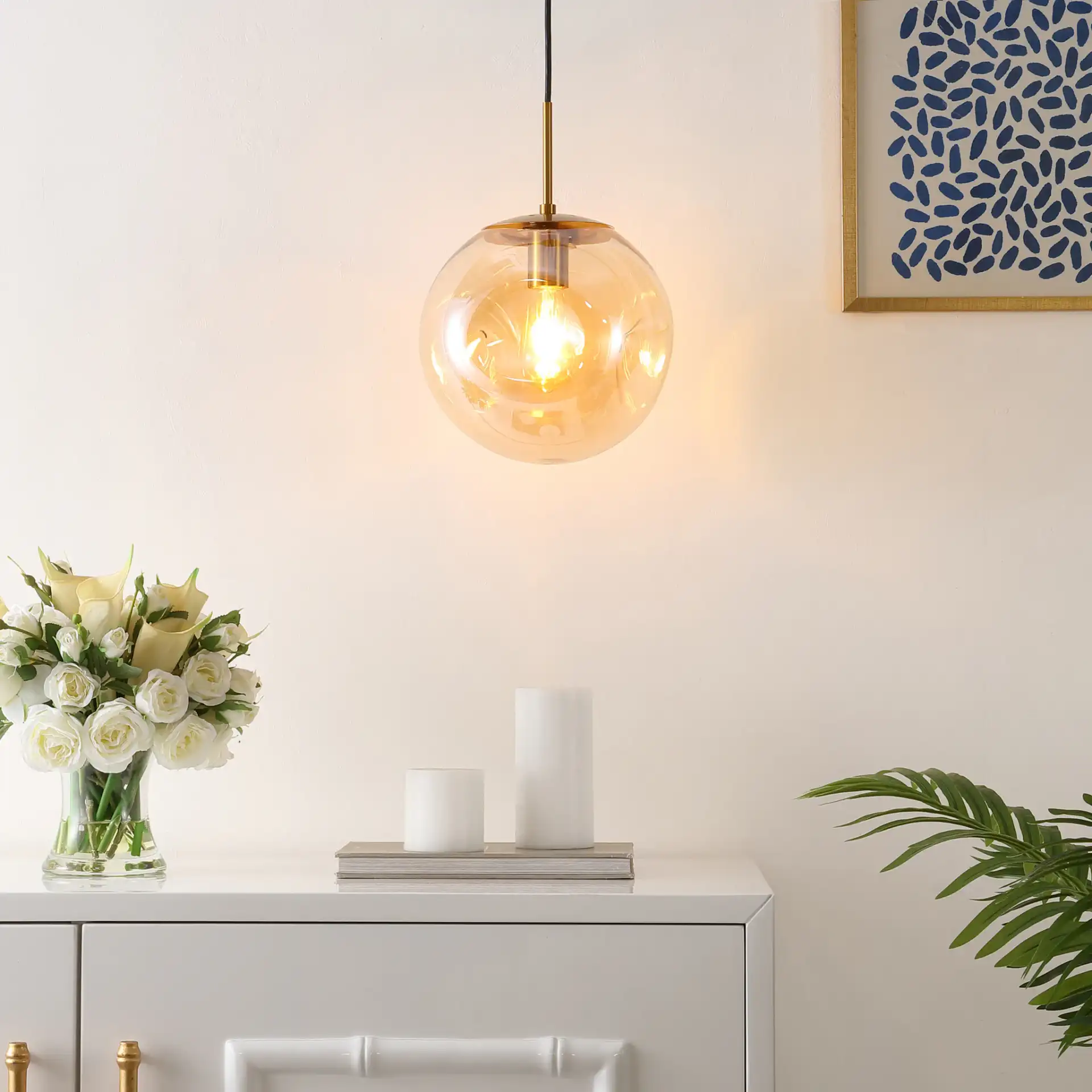Cyril Pendant in Amber / Brass in a styled room