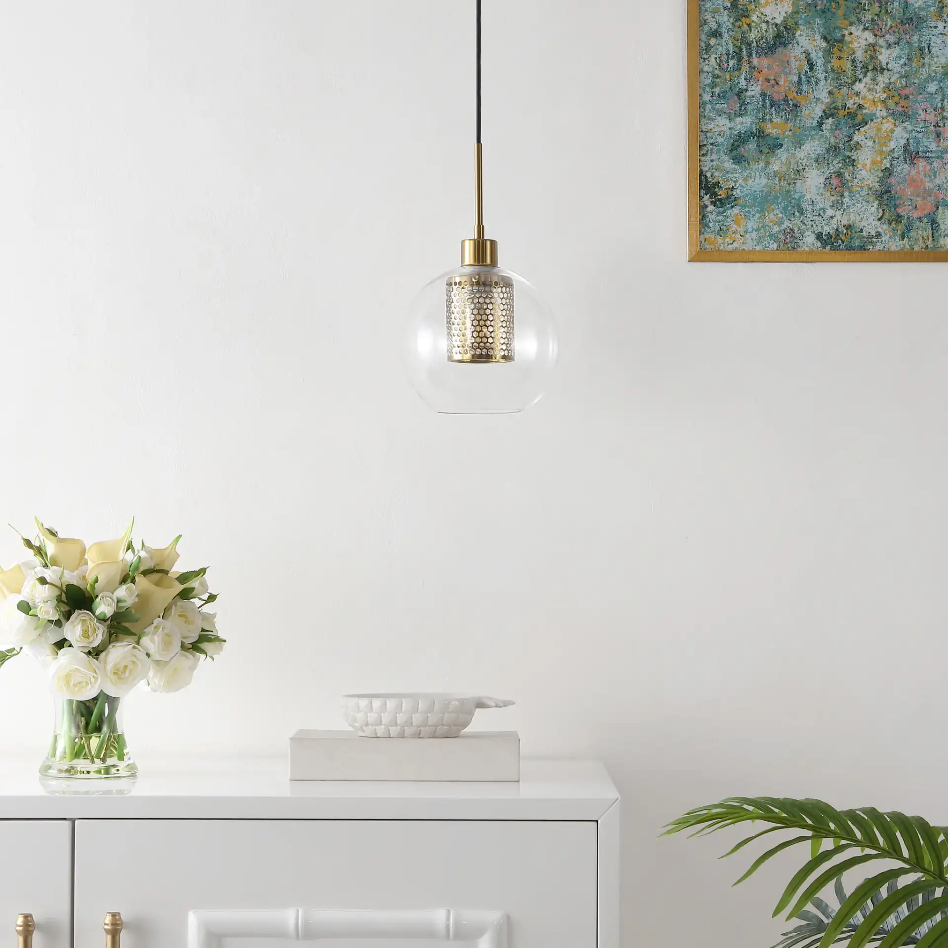 Toronto Pendant in Clear / Brass in a styled room
