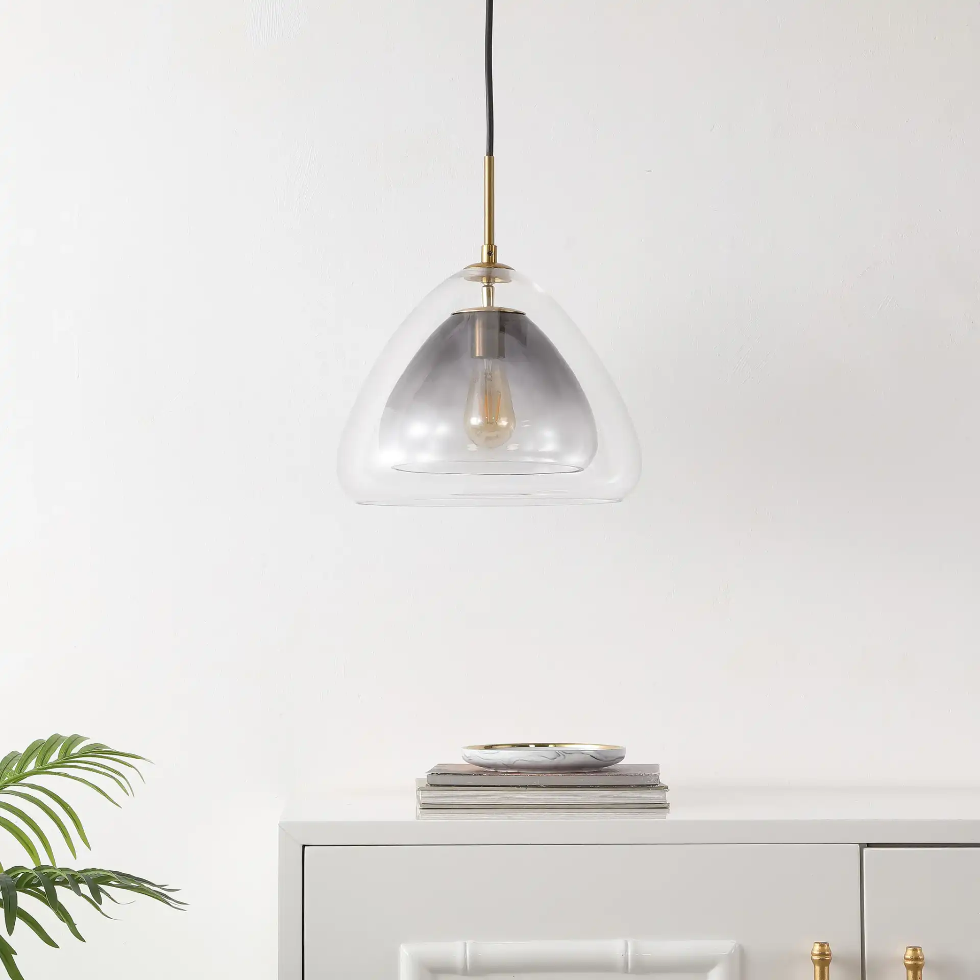 Eclipse Pendant in Smoke Gray / Brass in a styled room