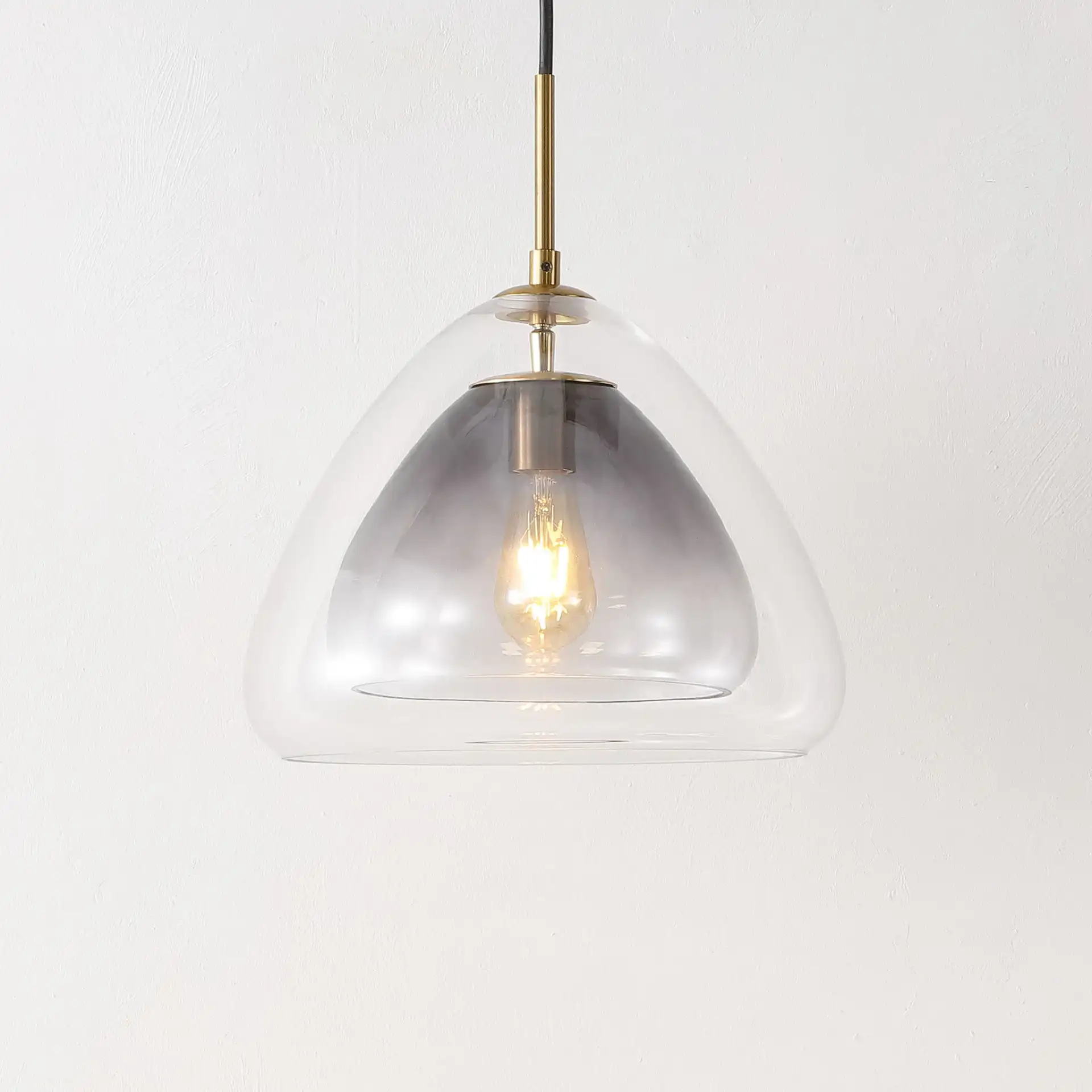 Eclipse Pendant in Smoke Gray / Brass in a styled room