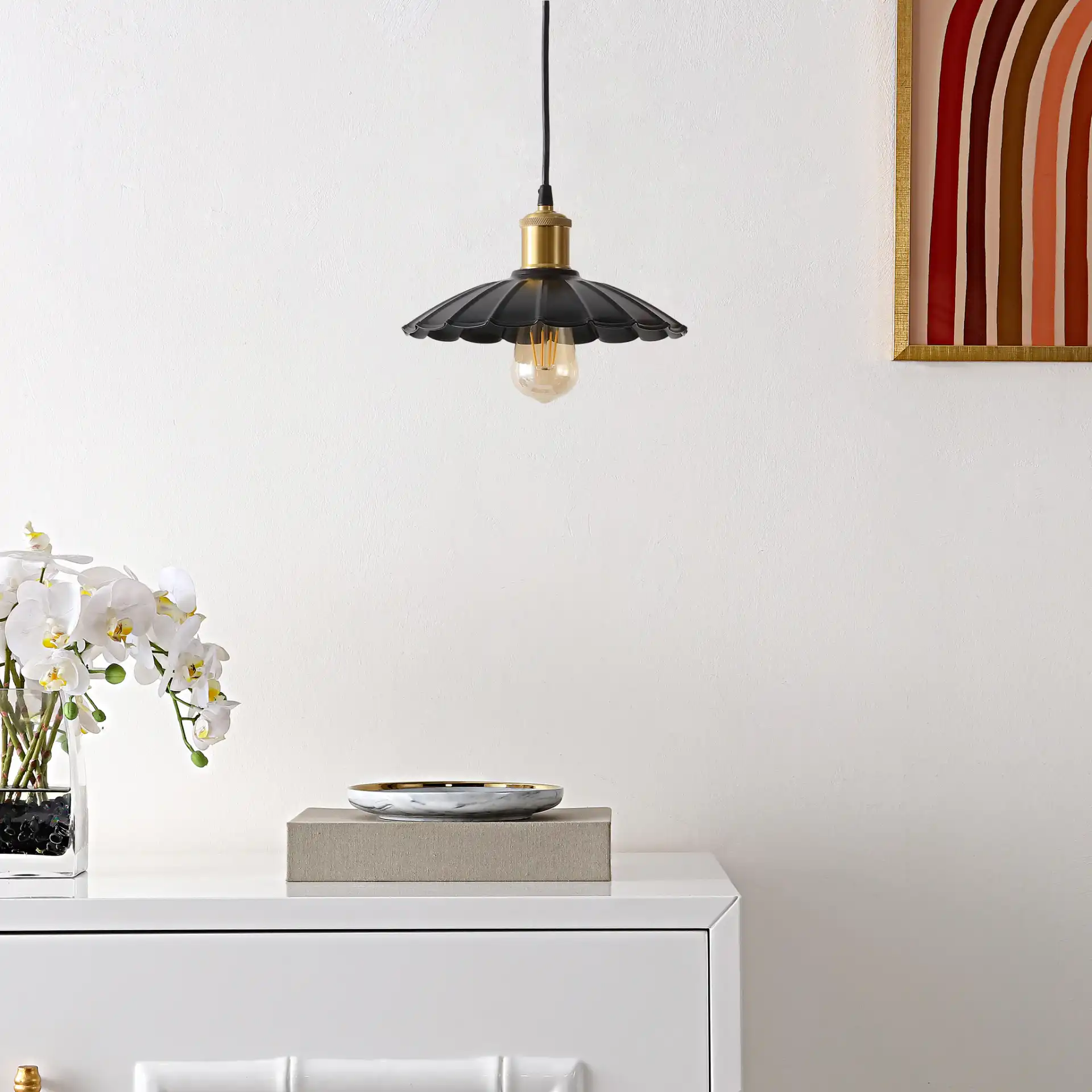 Novaire Pendant in Black / Brass in a styled room