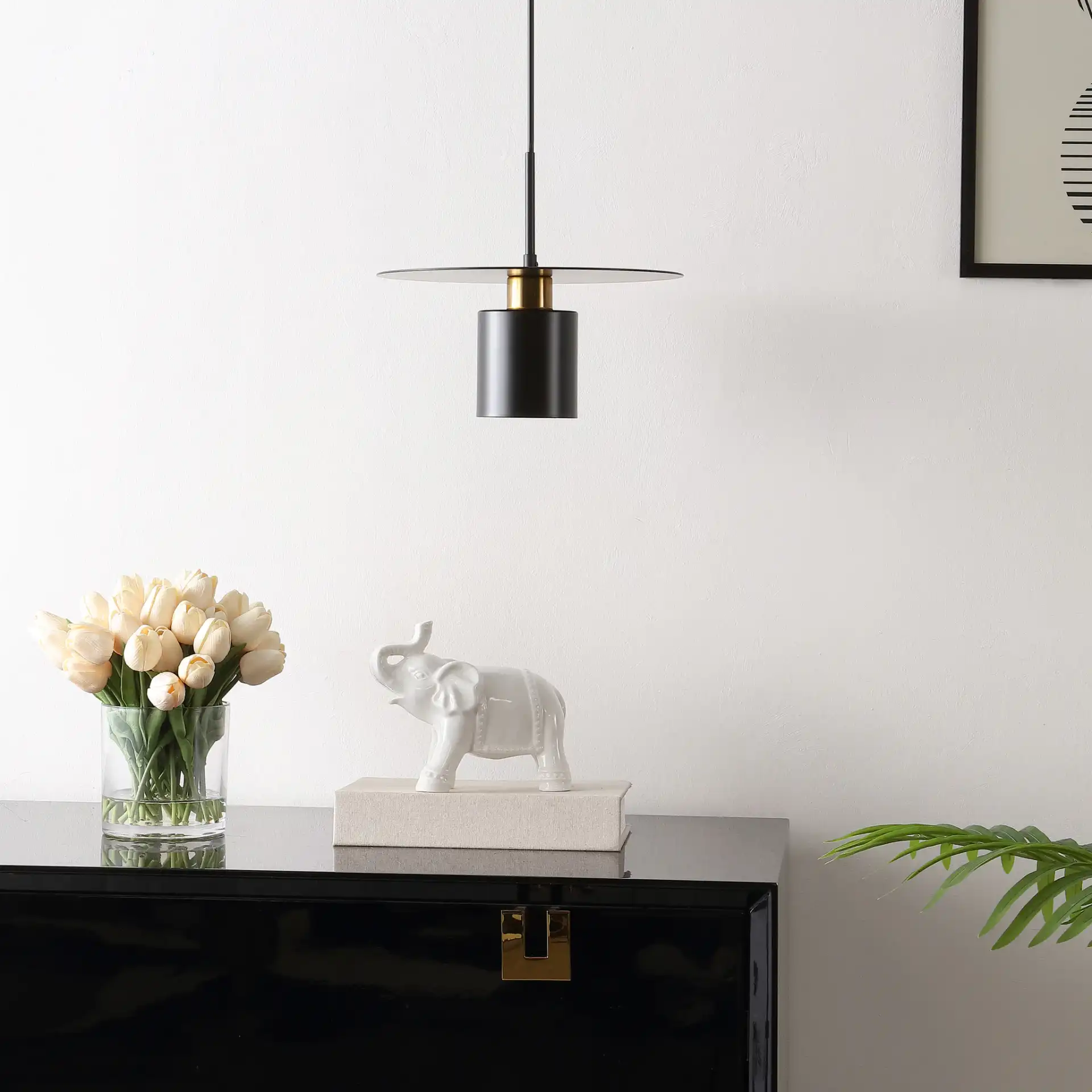 Mynoby Pendant in Black / Brass in a styled room