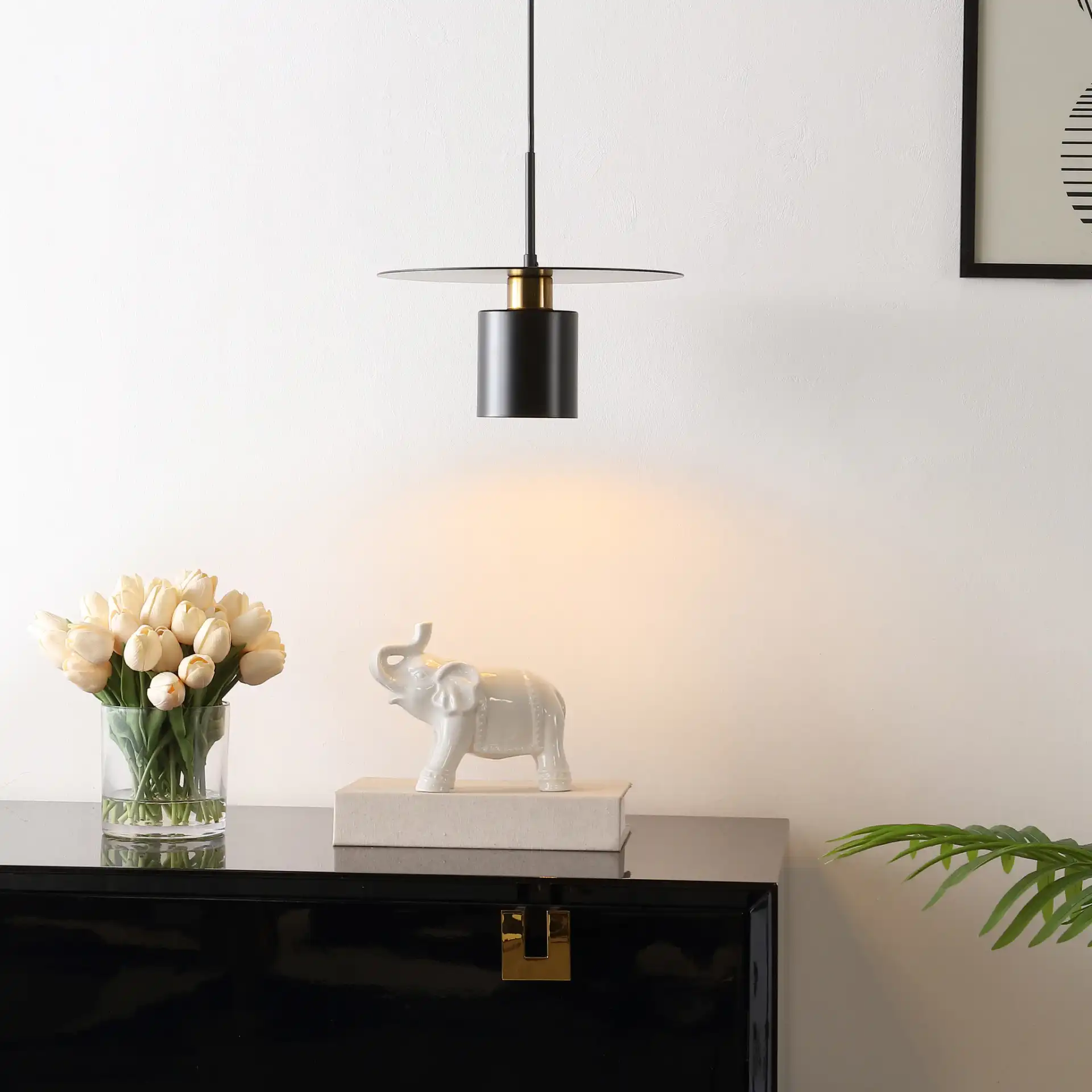 Mynoby Pendant in Black / Brass in a styled room