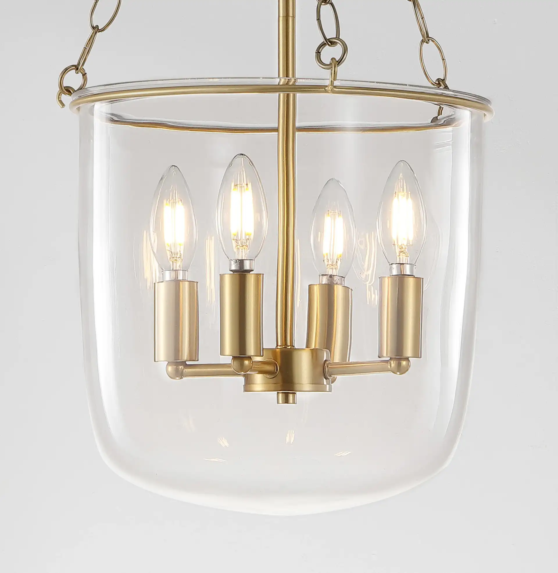 Dahye Four-Light Pendant in Clear / Brass in a styled room