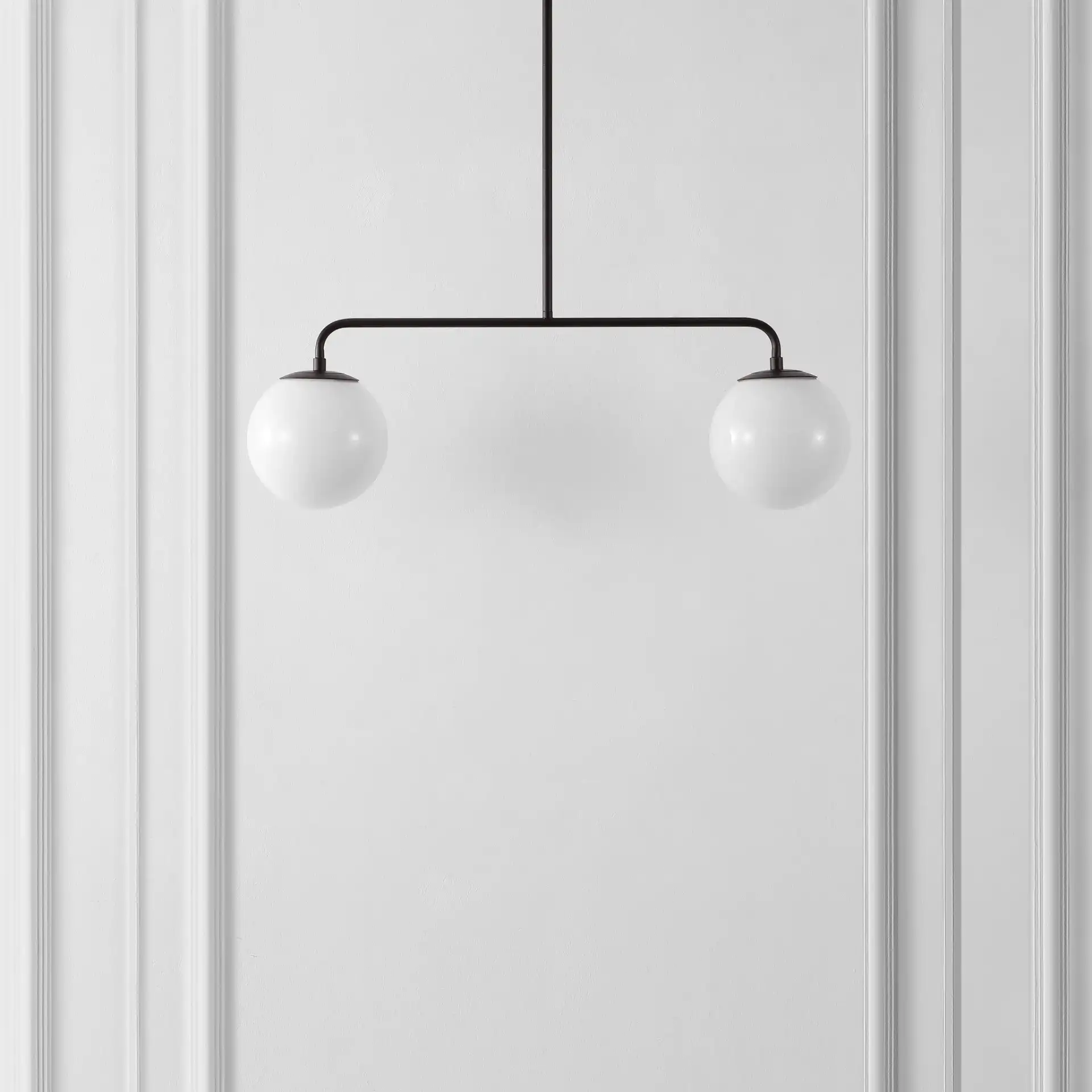 Conyer Two-Light Pendant in Black in a styled room