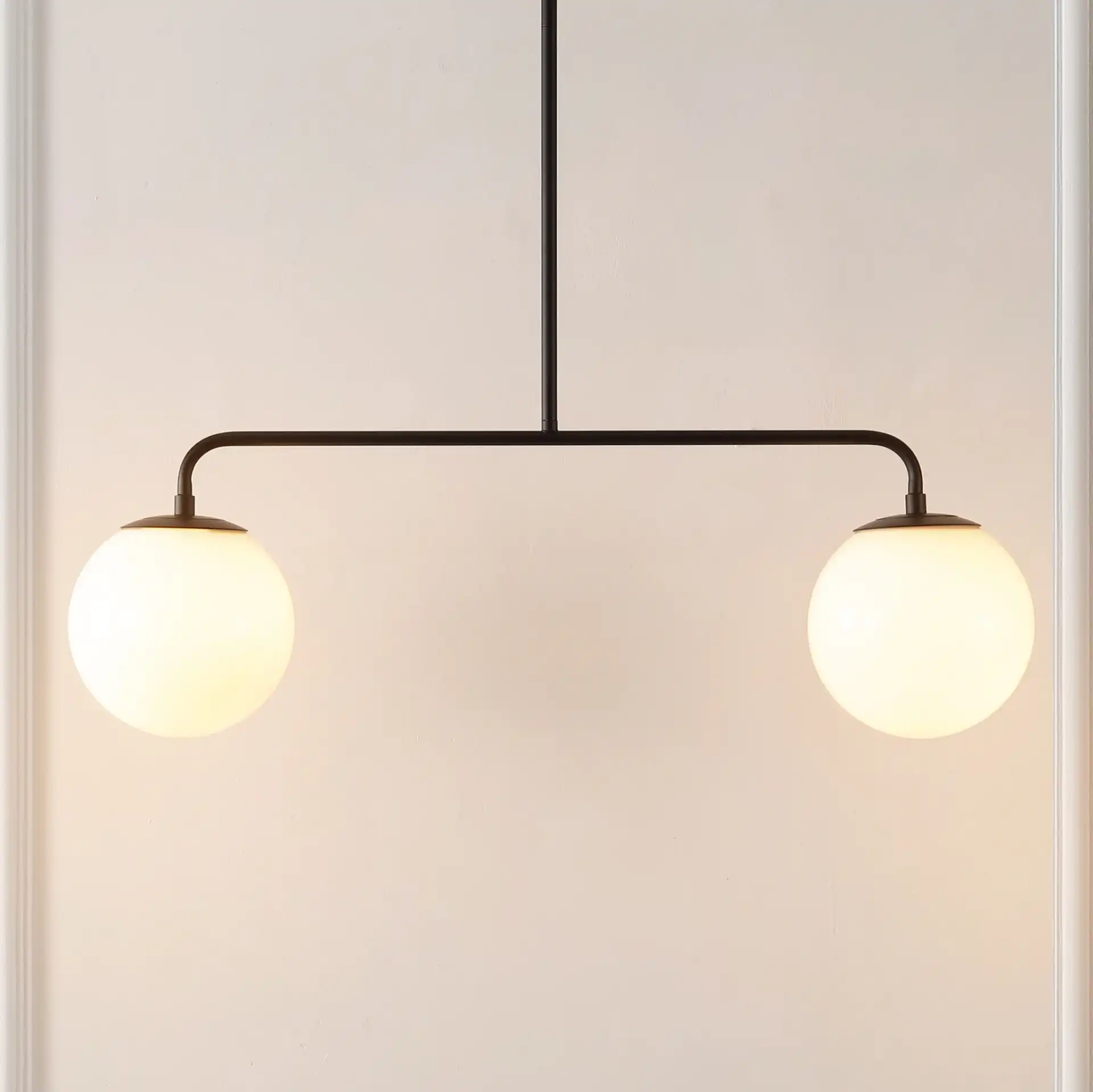 Conyer Two-Light Pendant in Black in a styled room