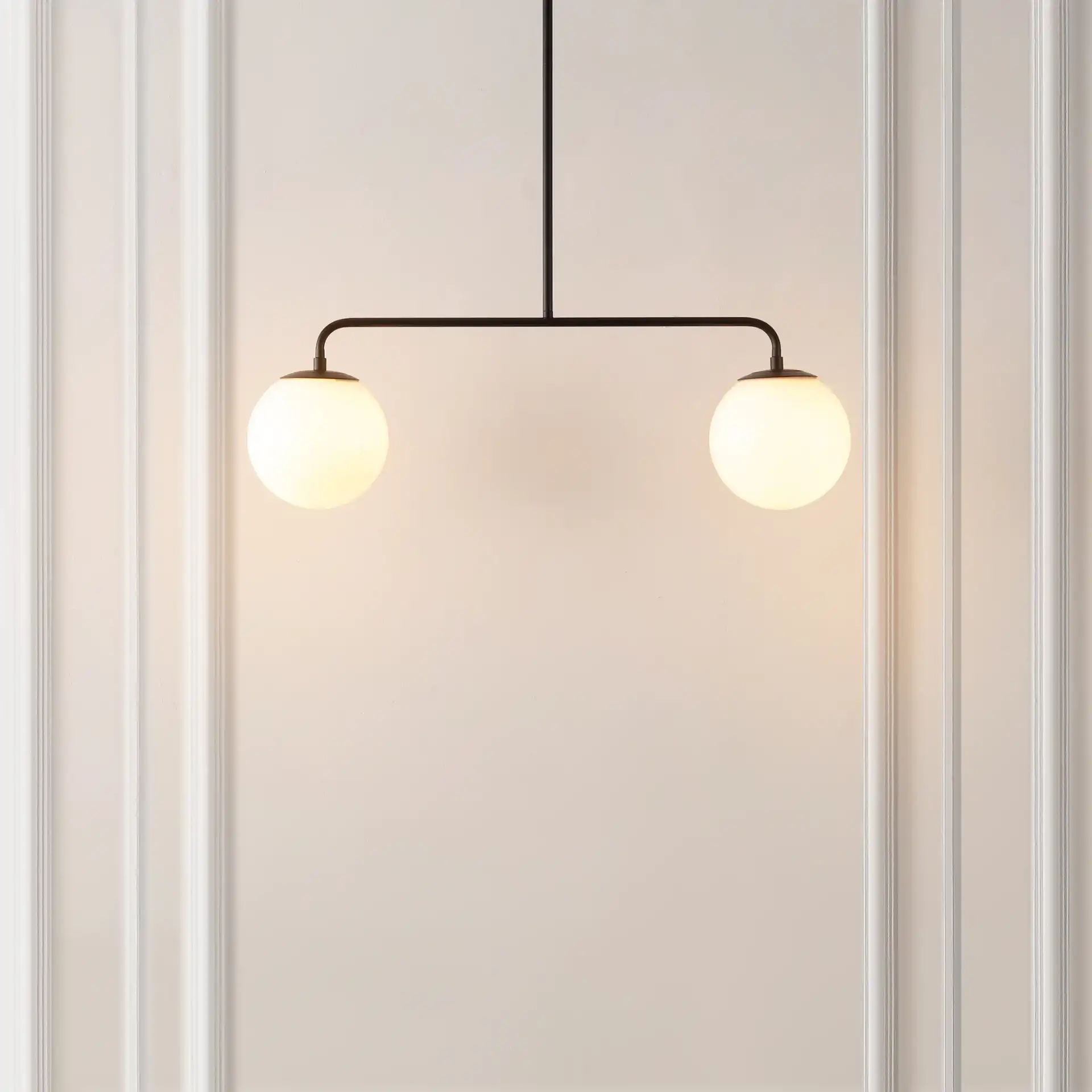 Conyer Two-Light Pendant in Black in a styled room