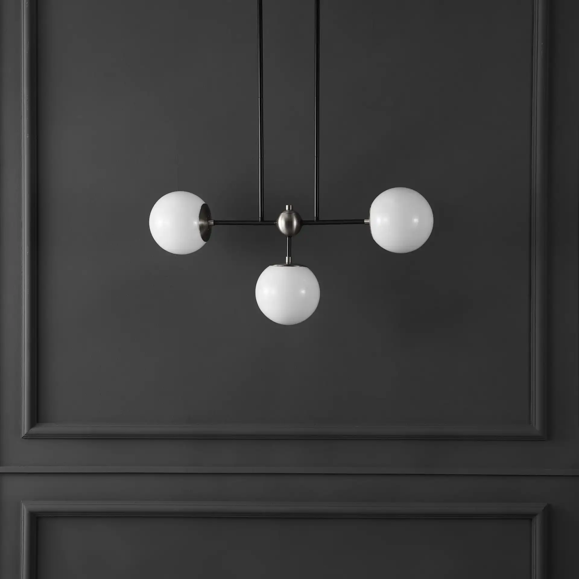 Collier Three-Light Pendant in Black / Nickel in a styled room