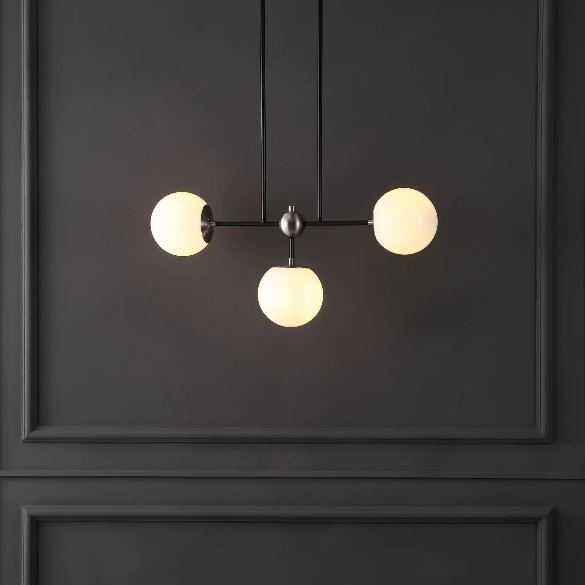 Collier Three-Light Pendant in Black / Nickel in a styled room