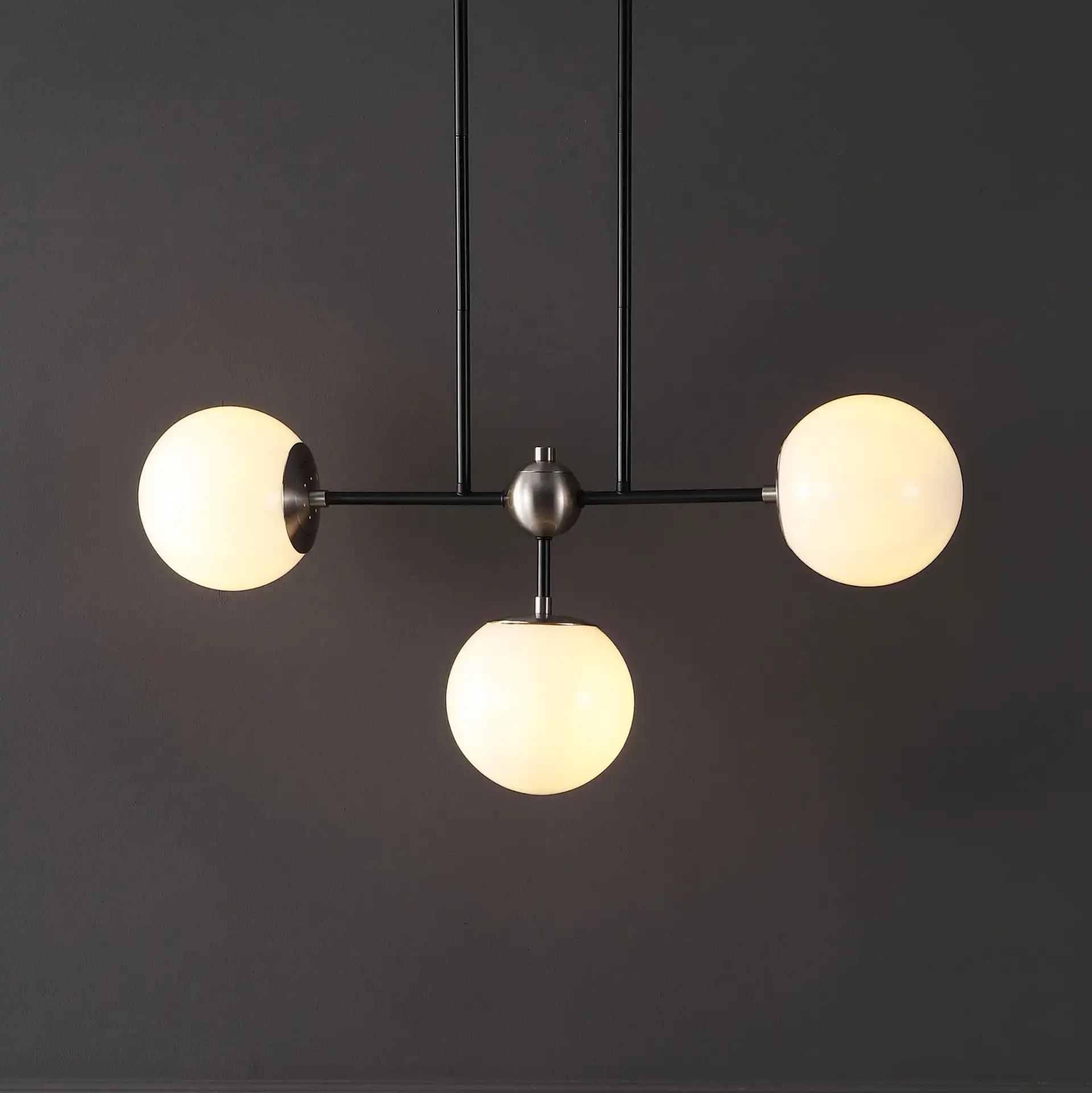 Collier Three-Light Pendant in Black / Nickel in a styled room