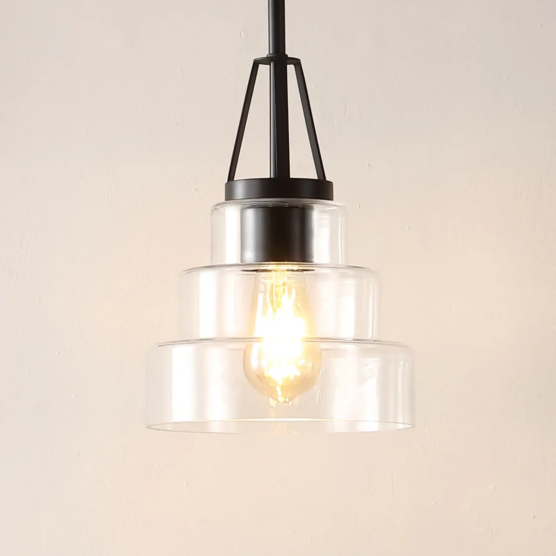 Raylen Pendant in Clear / Oil Rub Bronze in a styled room