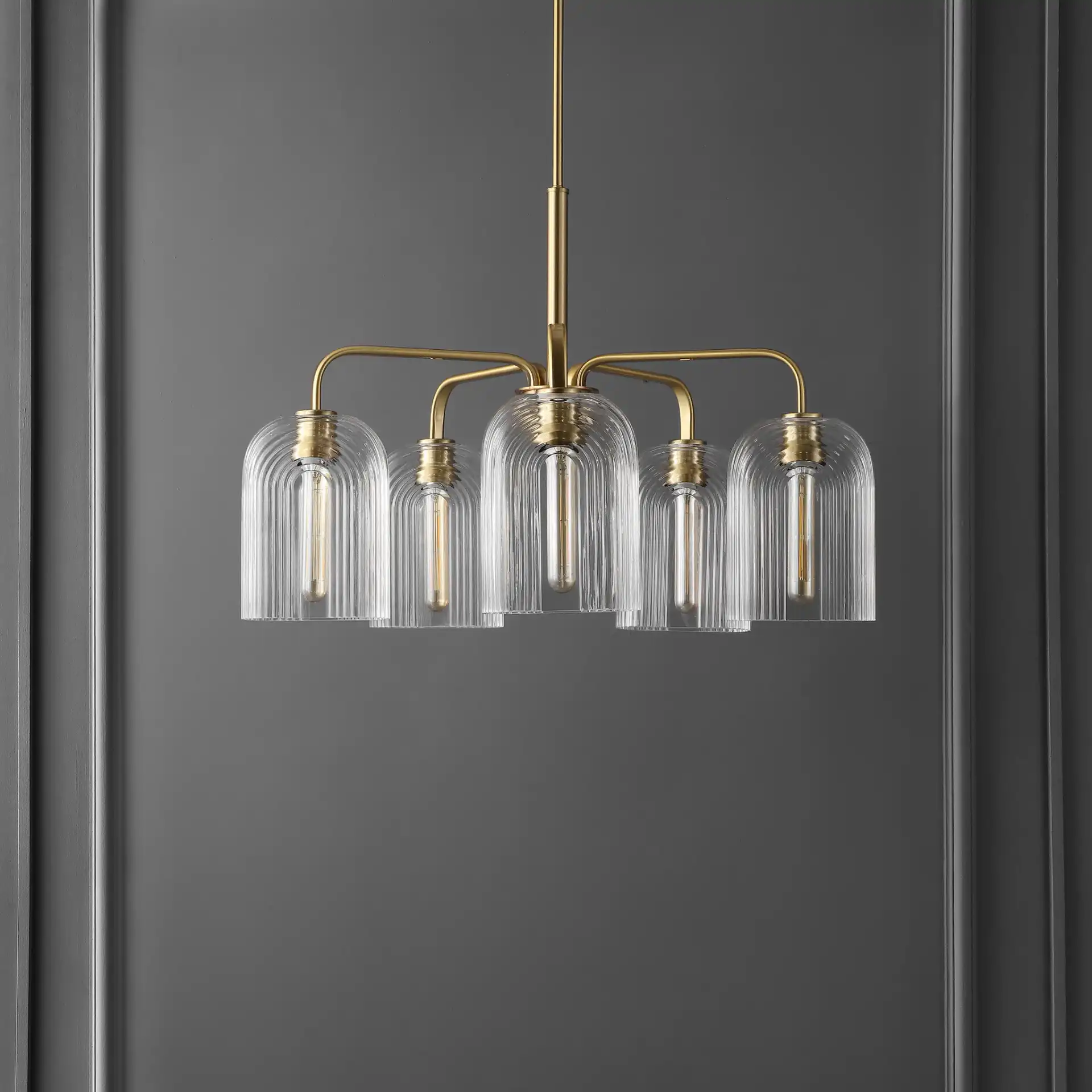 Idelle Five-Light Pendant in Brass in a styled room