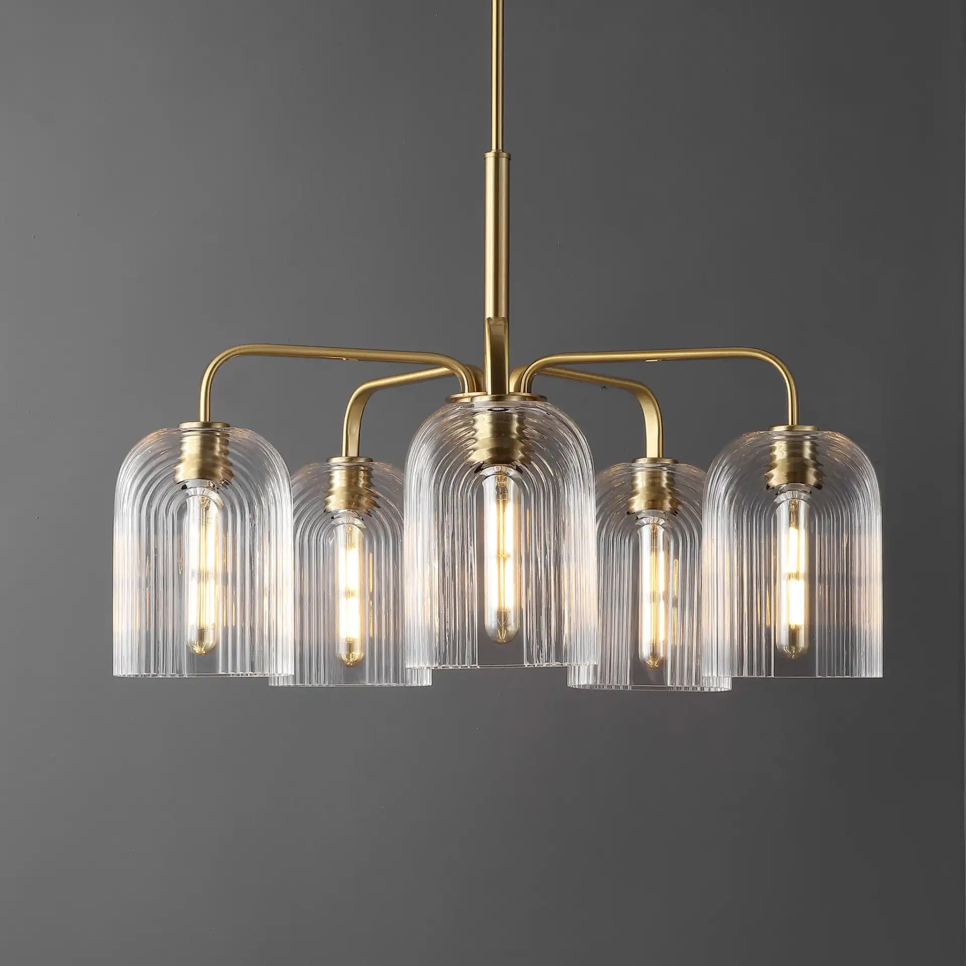 Idelle Five-Light Pendant in Brass in a styled room