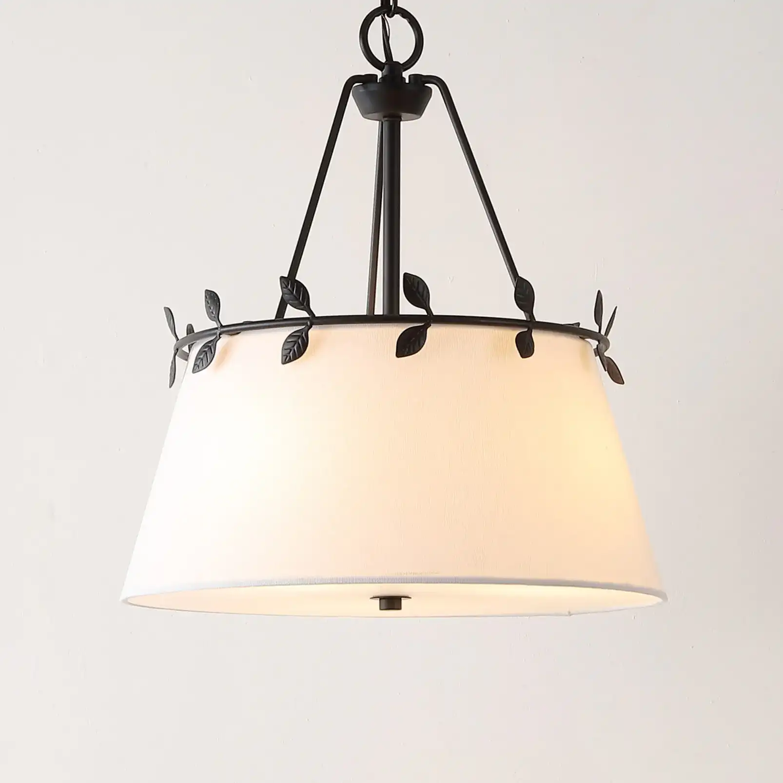 Samora Three-Light Pendant in White / Black in a styled room