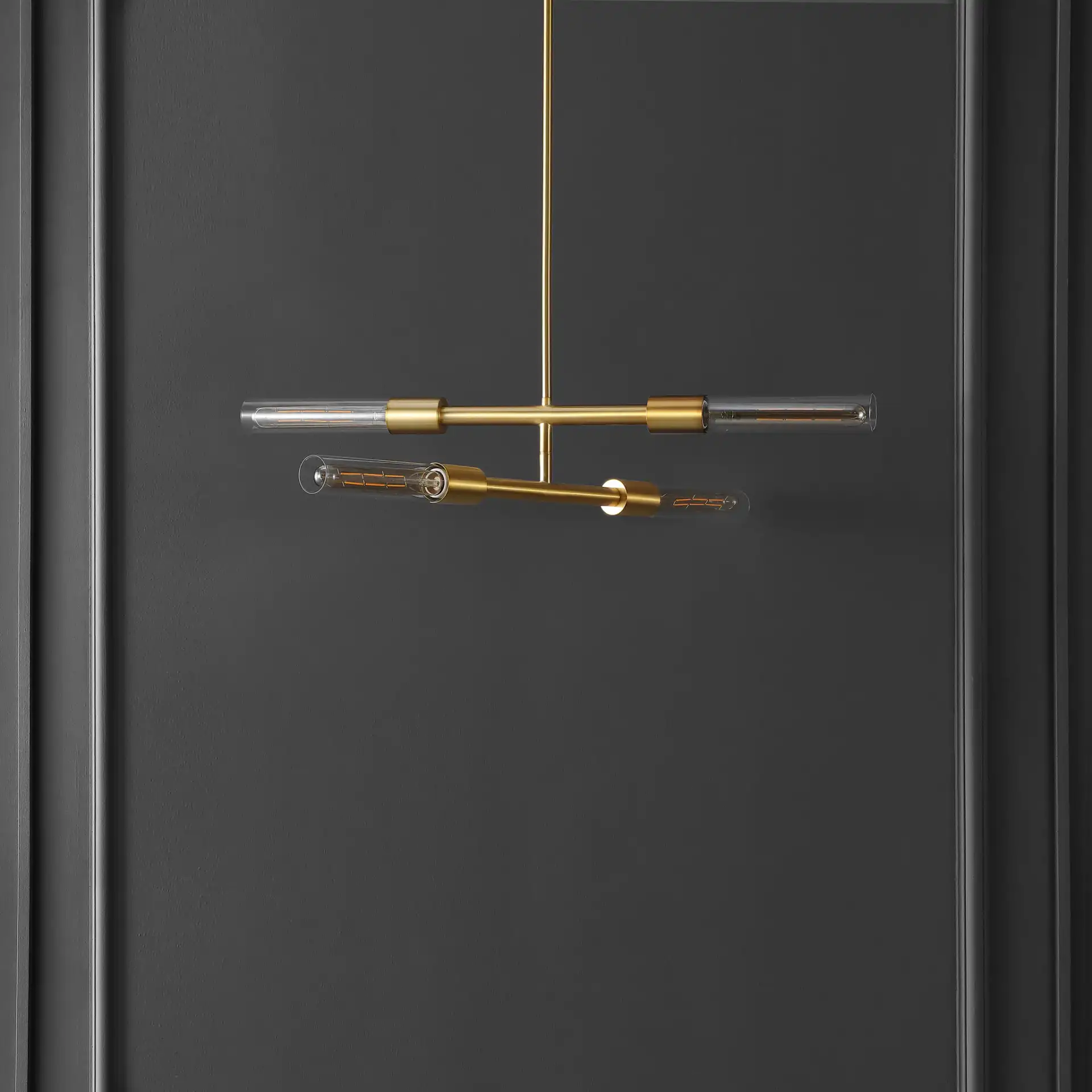 Cronos Four-Light Pendant in Brass / Clear in a styled room