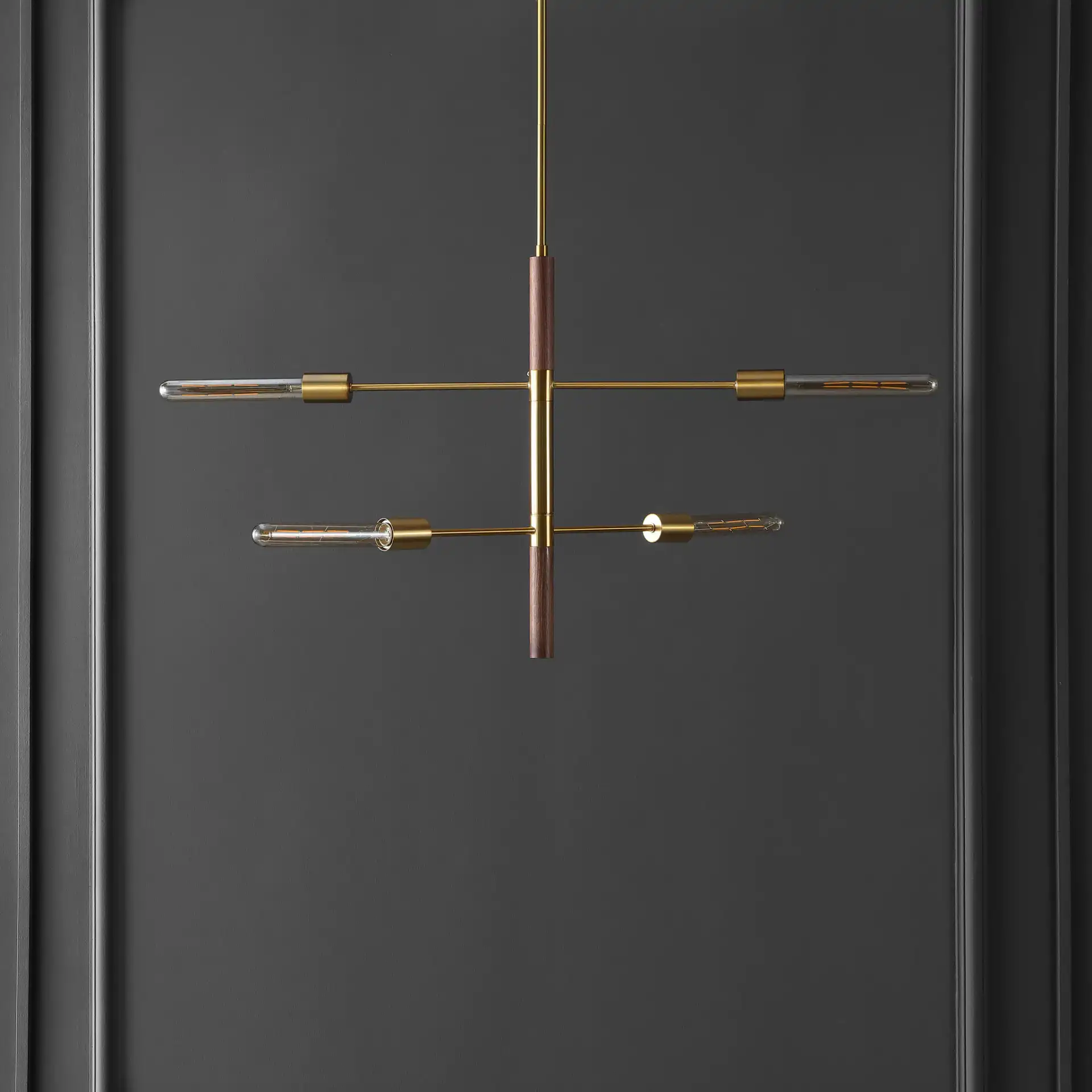 Viceroy Four-Light Pendant in Brass / Walnut in a styled room