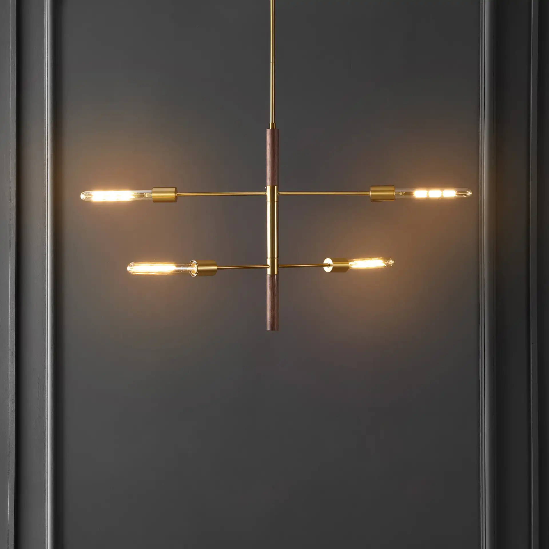Viceroy Four-Light Pendant in Brass / Walnut in a styled room