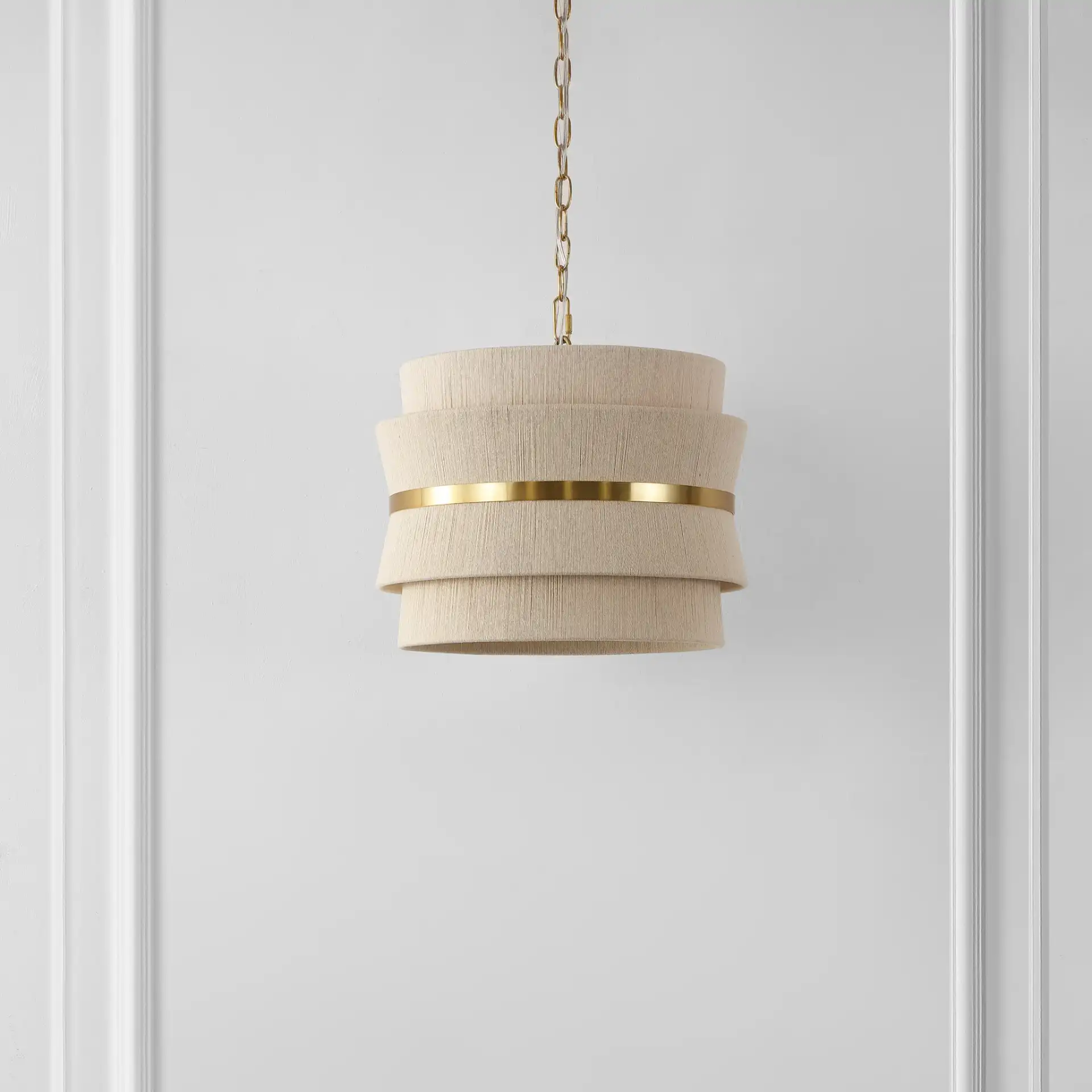 Willa Three-Light Pendant in Bleached Natural / Brass in a styled room