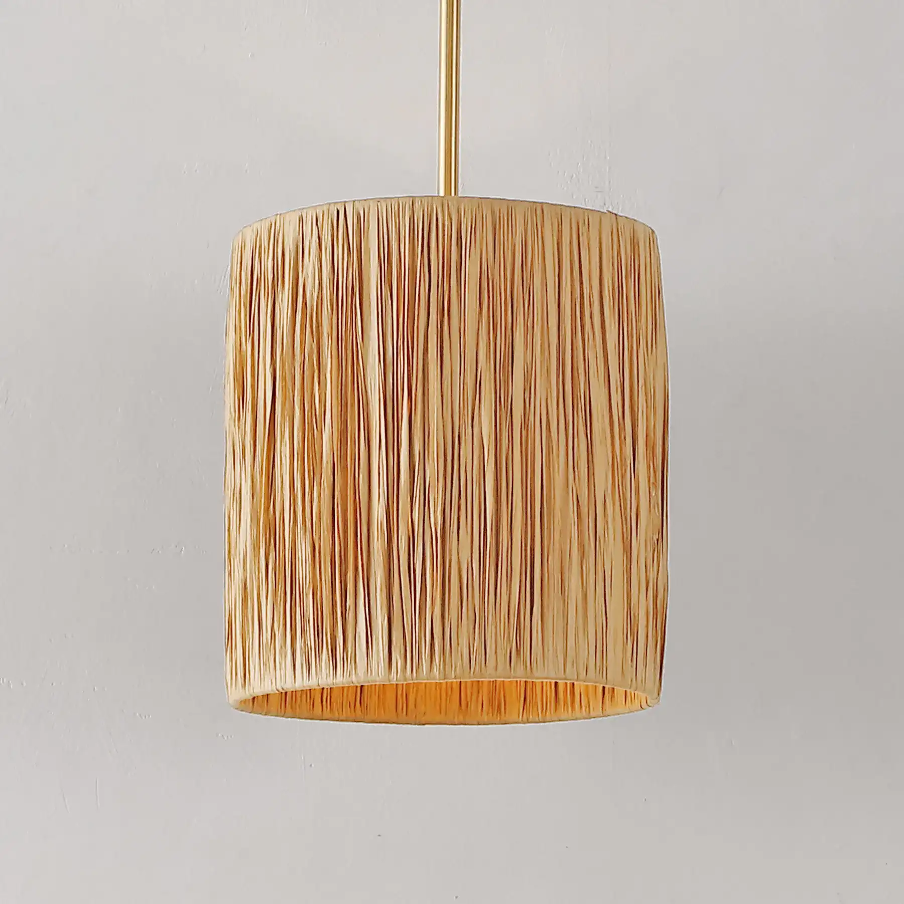 Saija Pendant in Natural / Gold in a styled room
