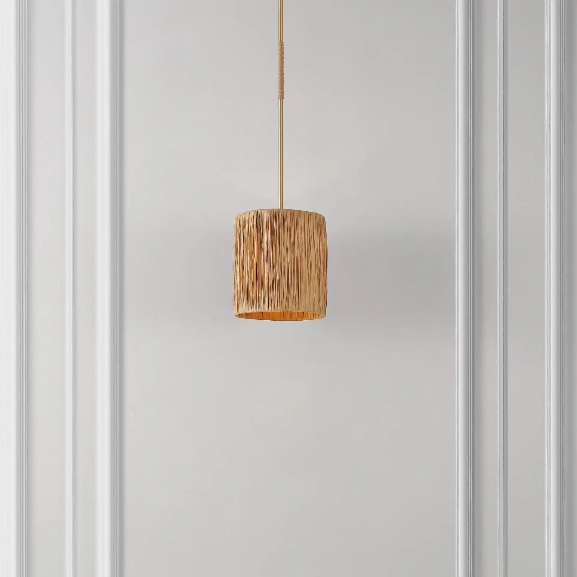 Saija Pendant in Natural / Gold in a styled room