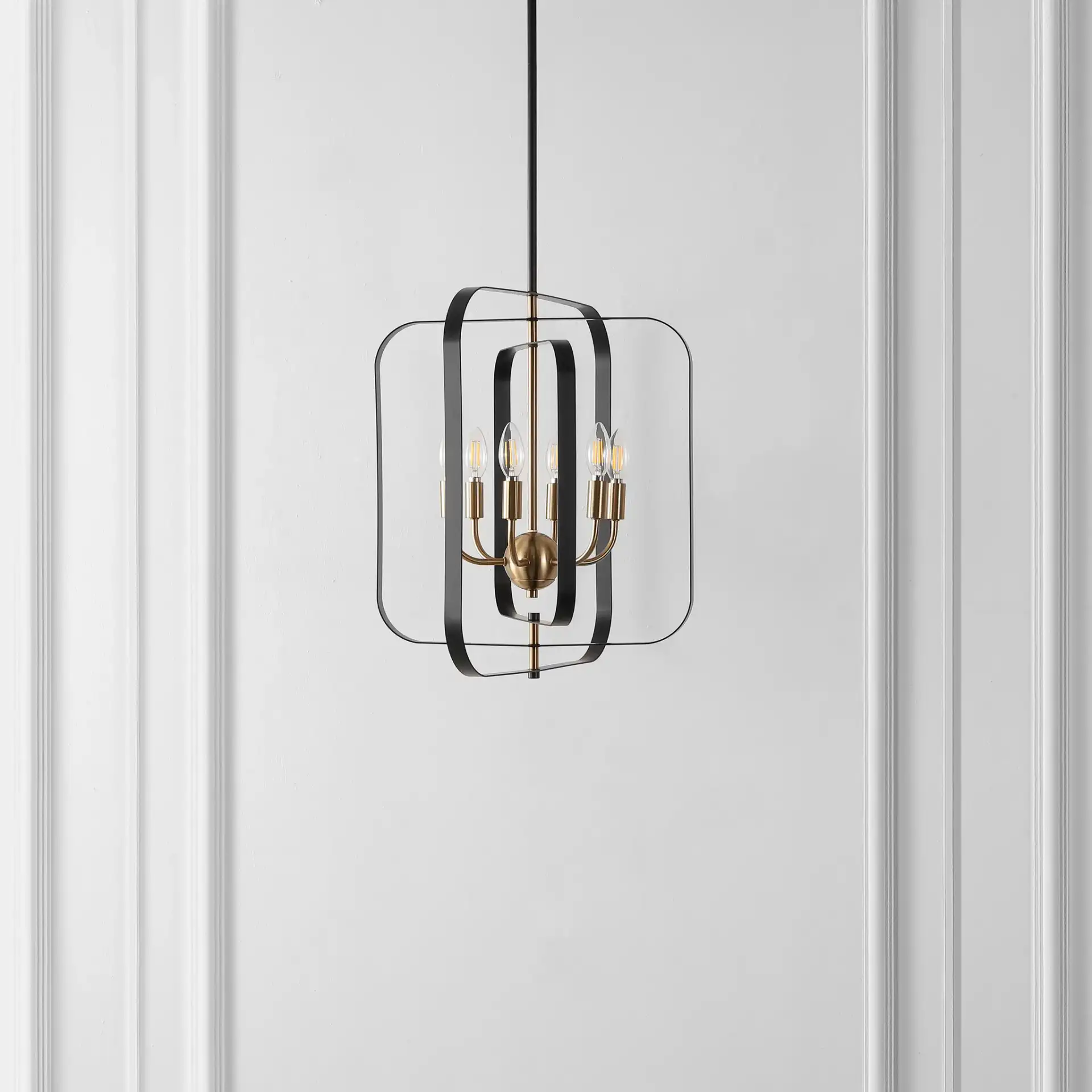 Dellyth Six-Light Pendant in Black / Brass in a styled room