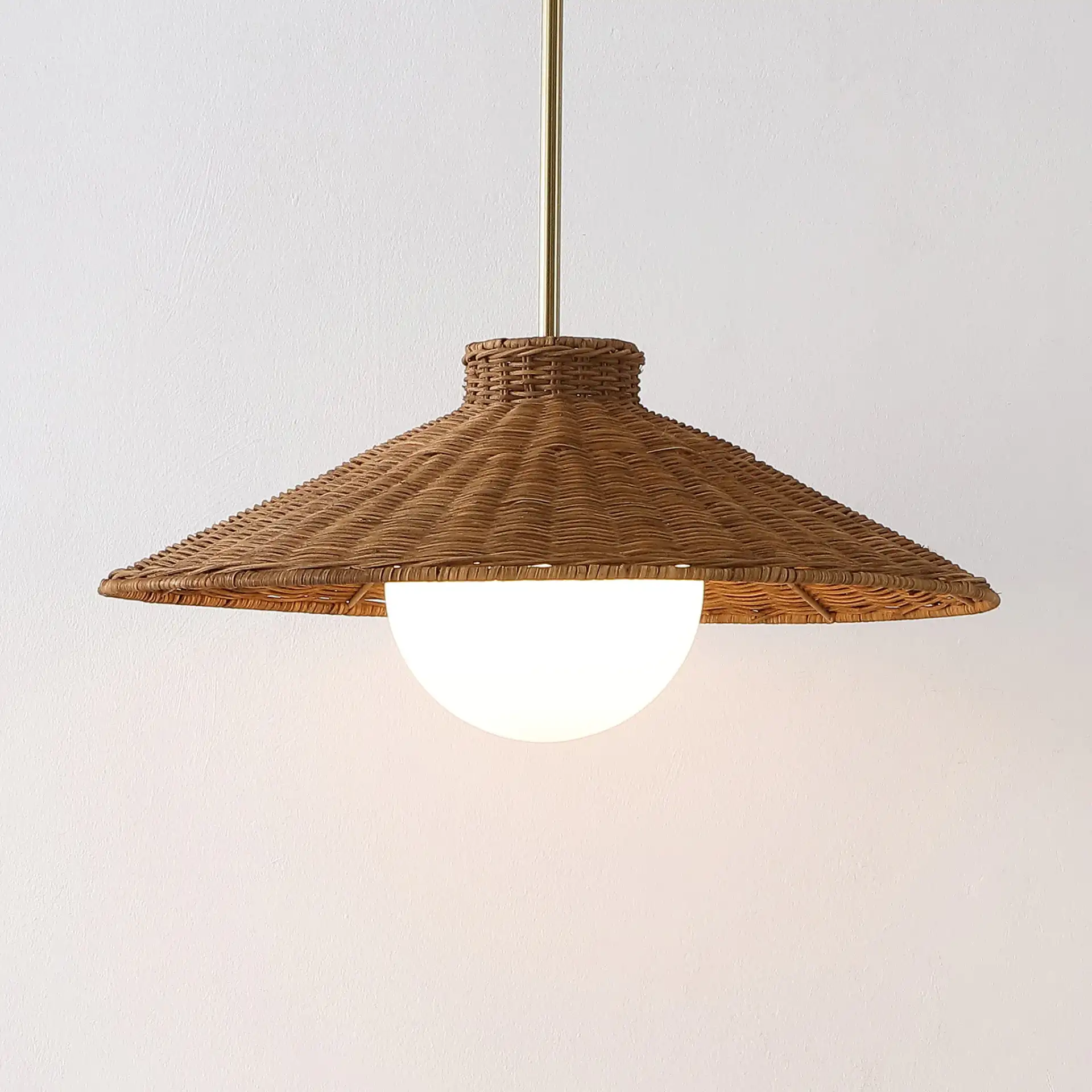 Kalena Pendant in Natural / Brass in a styled room
