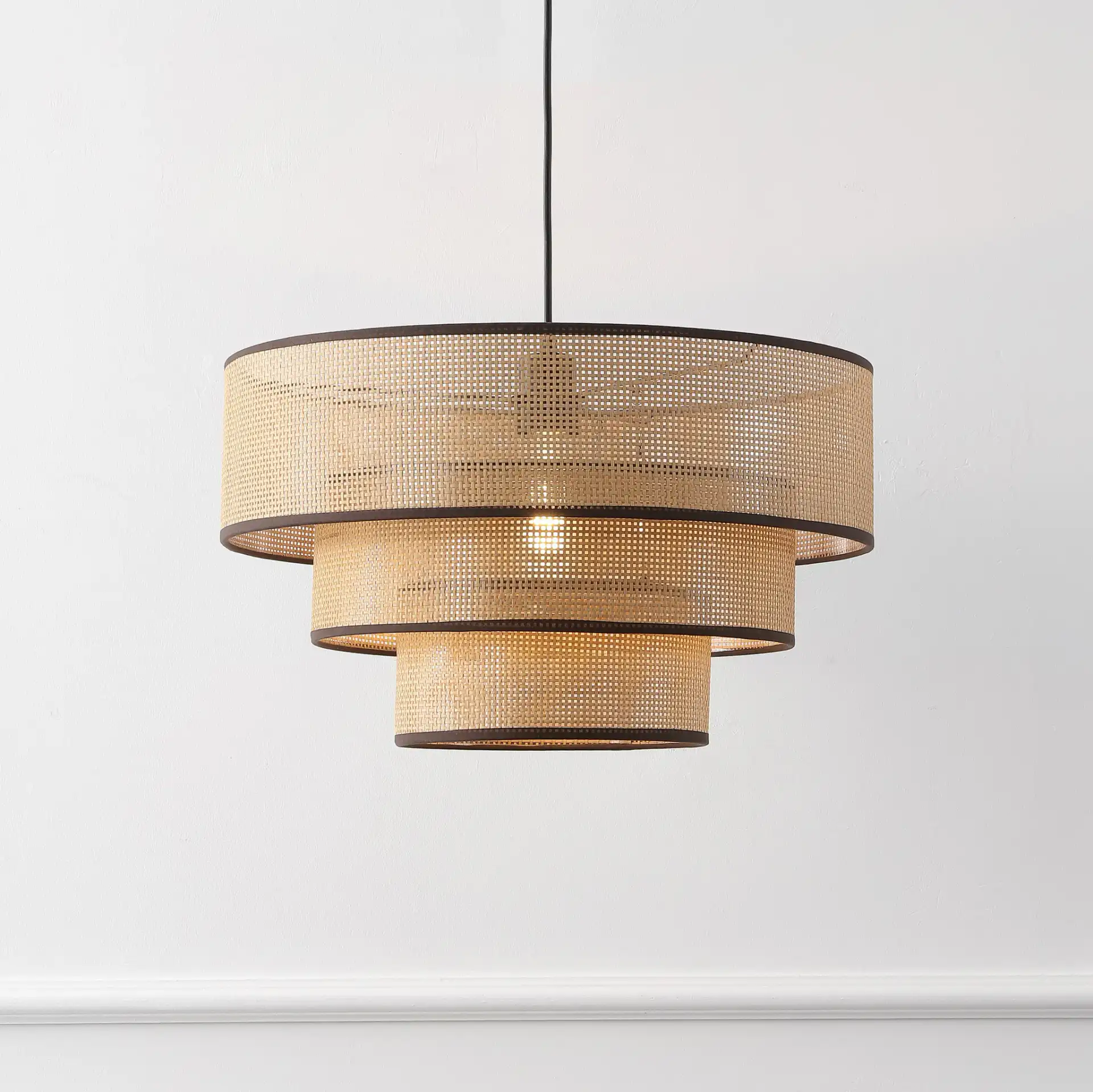 Malya Pendant in Brown / Natural in a styled room