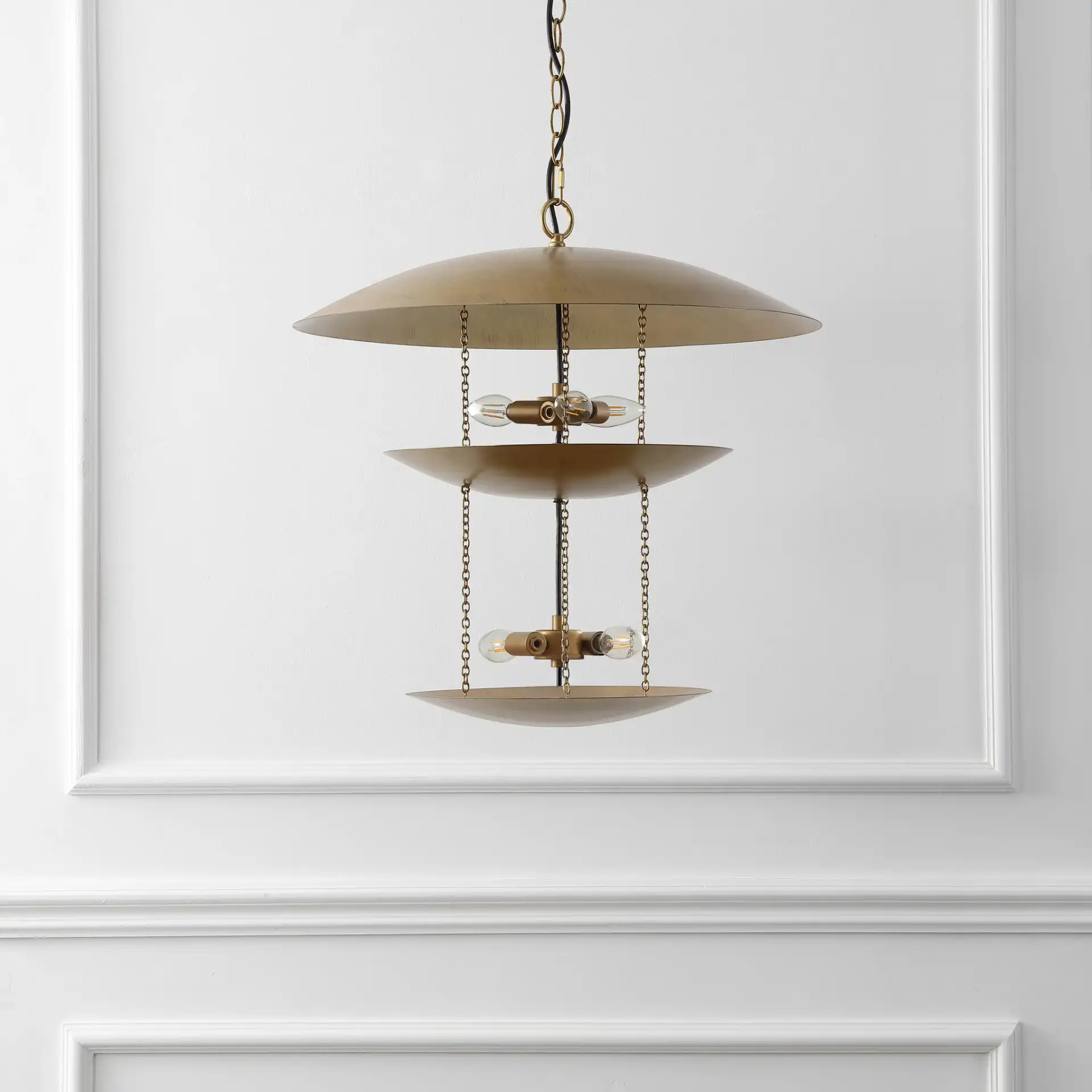 Jules Five-Light Pendant in Antique Gold in a styled room