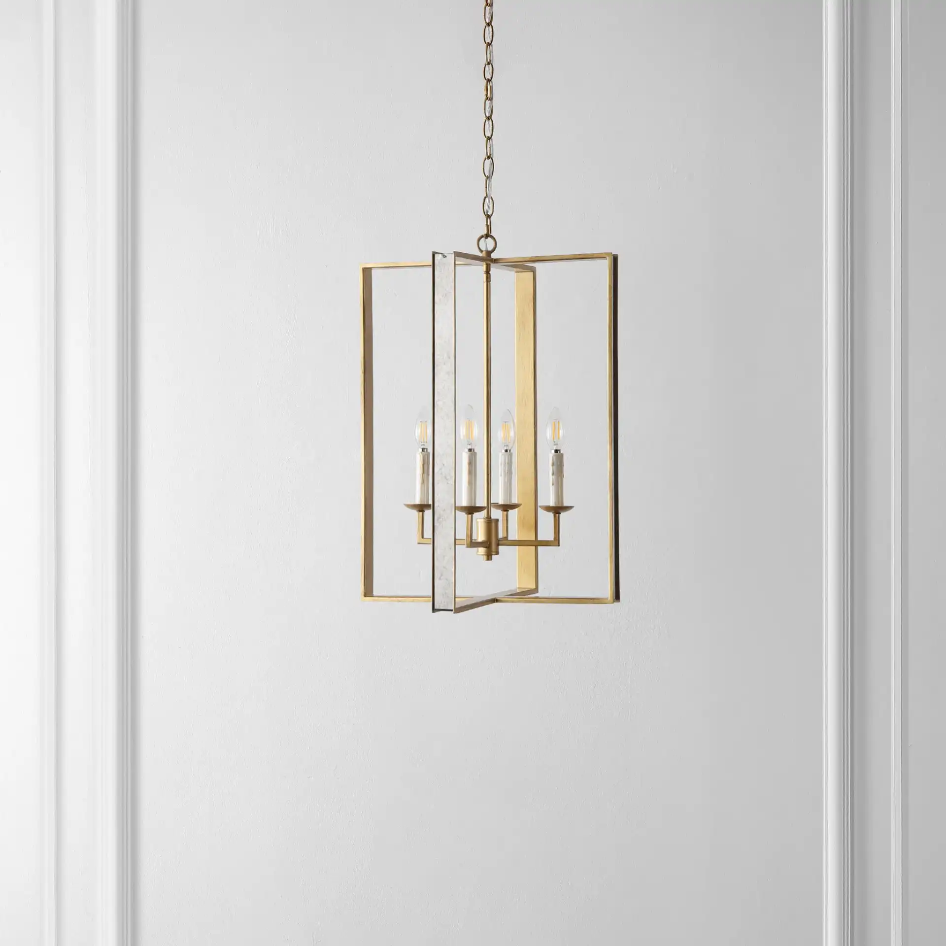 Morella Four-Light Pendant in Antique Gold in a styled room