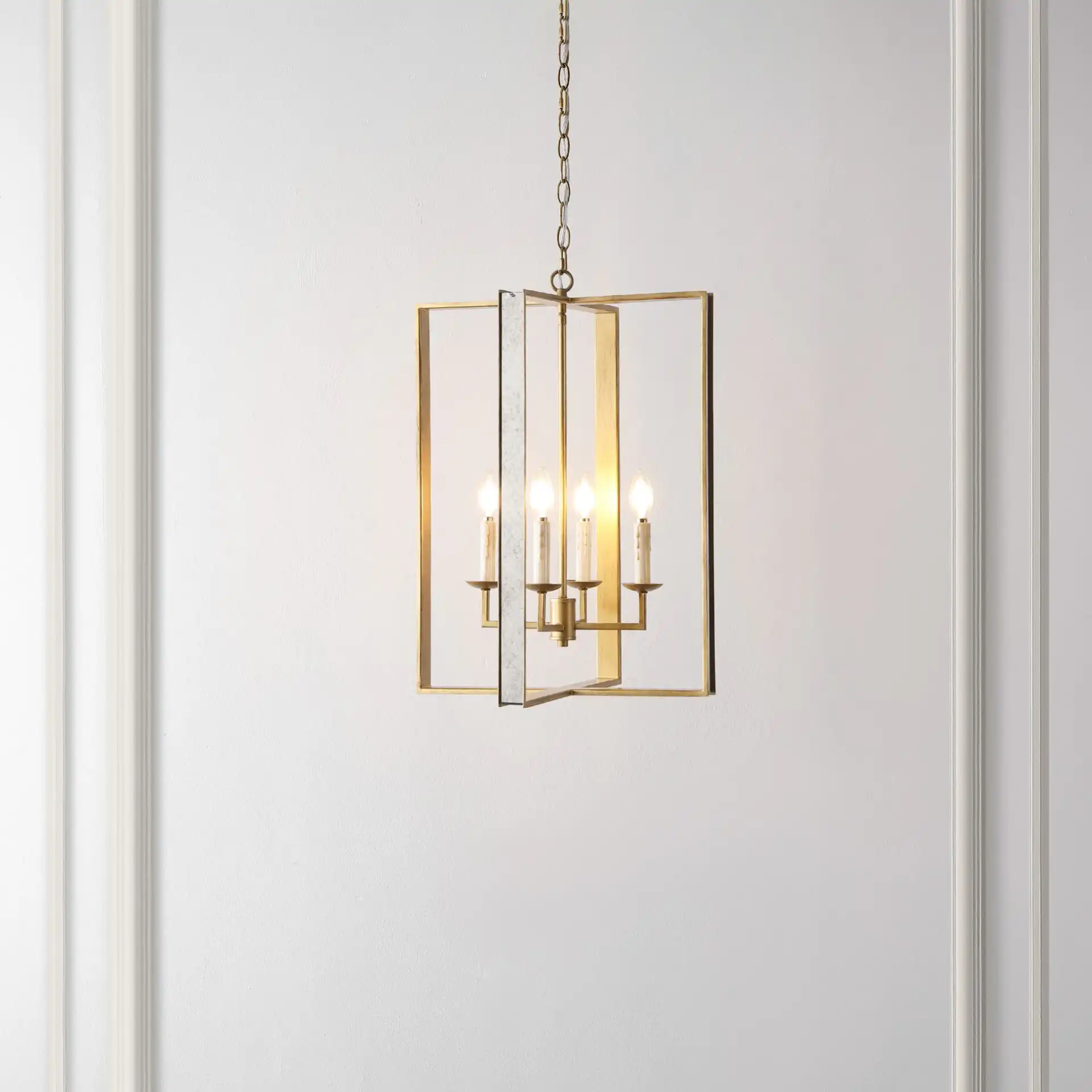 Morella Four-Light Pendant in Antique Gold in a styled room