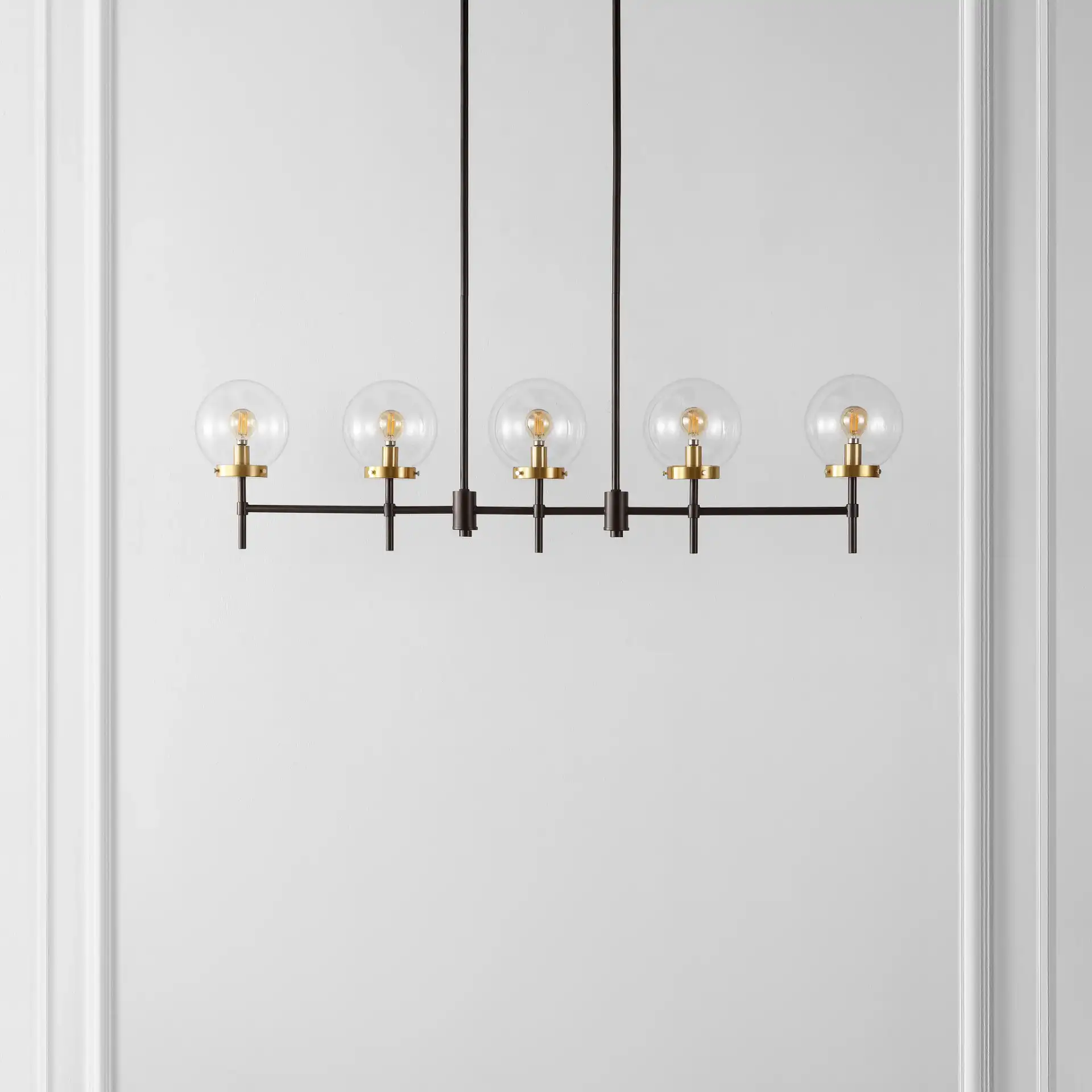Mylah Five-Light Pendant in Oil Rub Bronze / Brass in a styled room