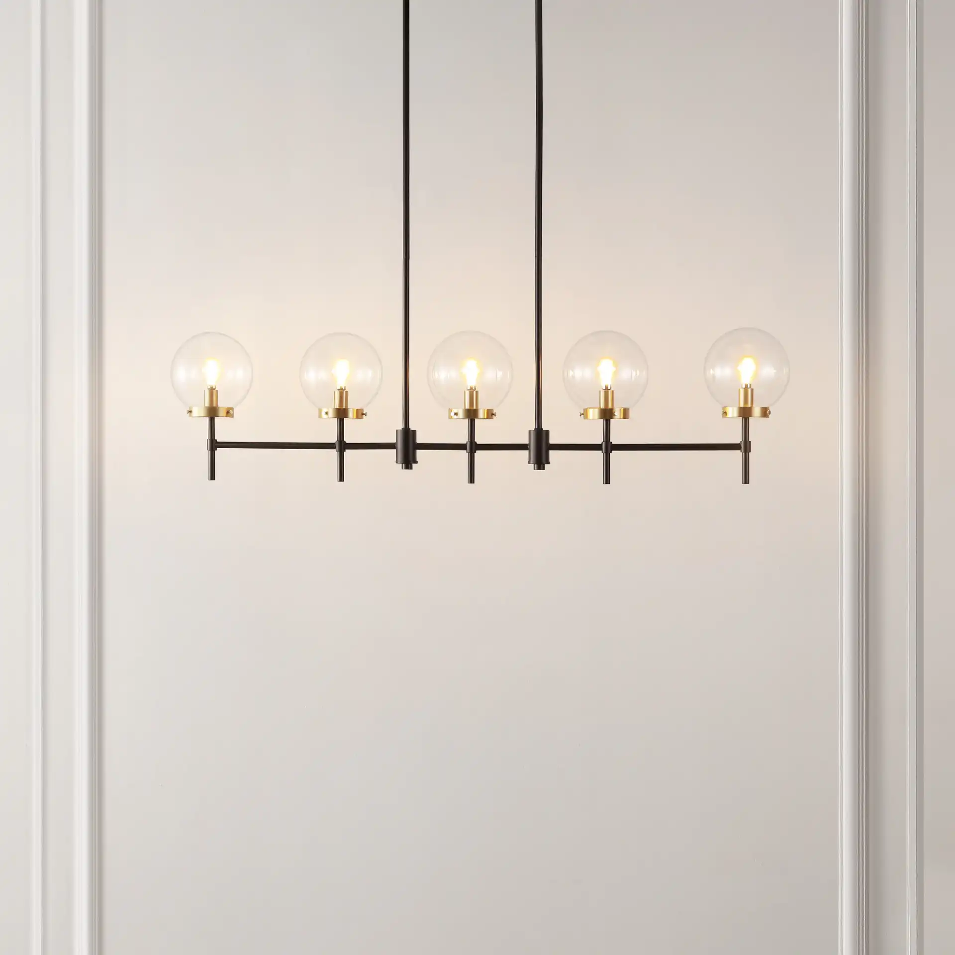 Mylah Five-Light Pendant in Oil Rub Bronze / Brass in a styled room