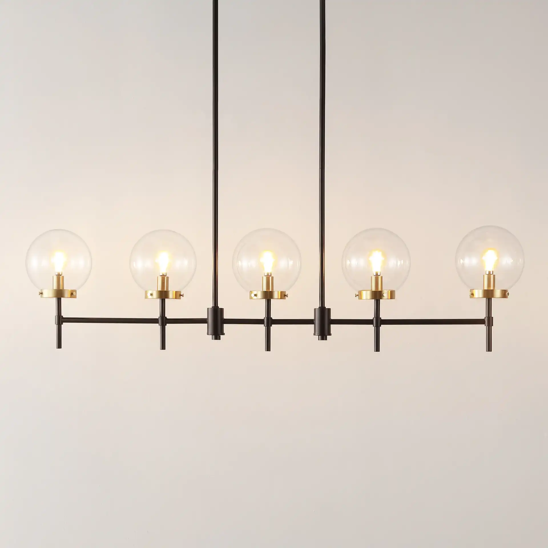 Mylah Five-Light Pendant in Oil Rub Bronze / Brass in a styled room