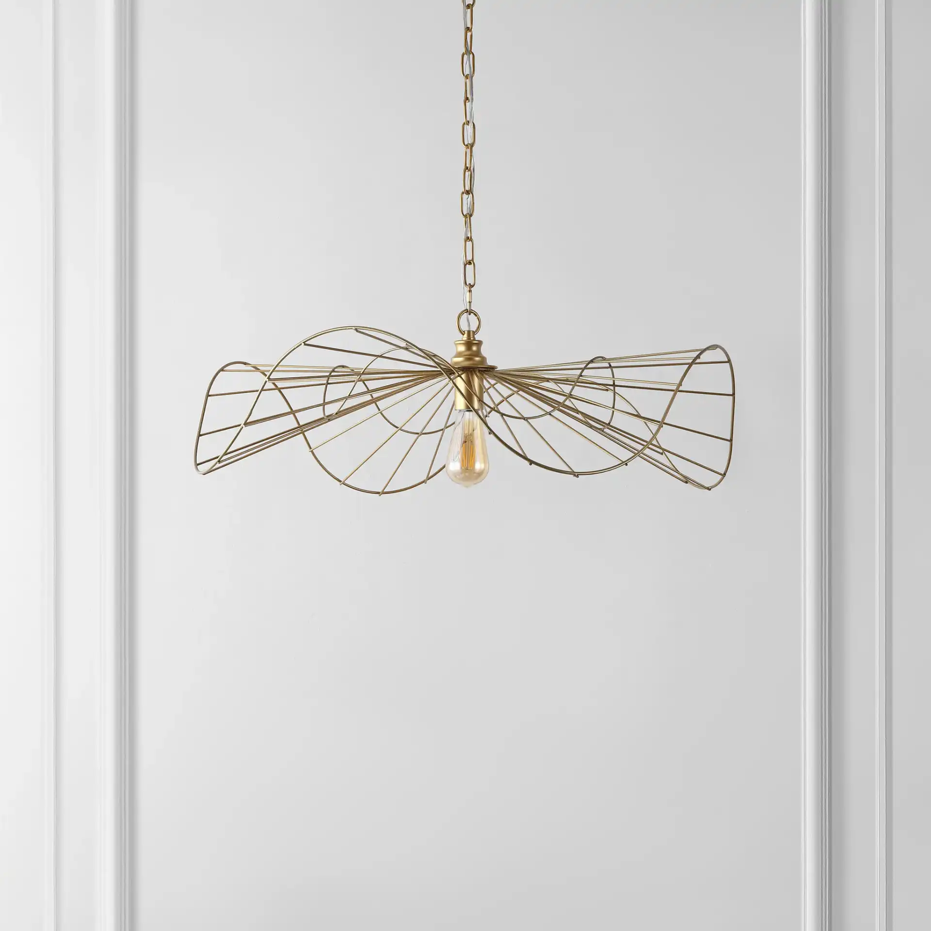 Mikola Pendant in Gold in a styled room