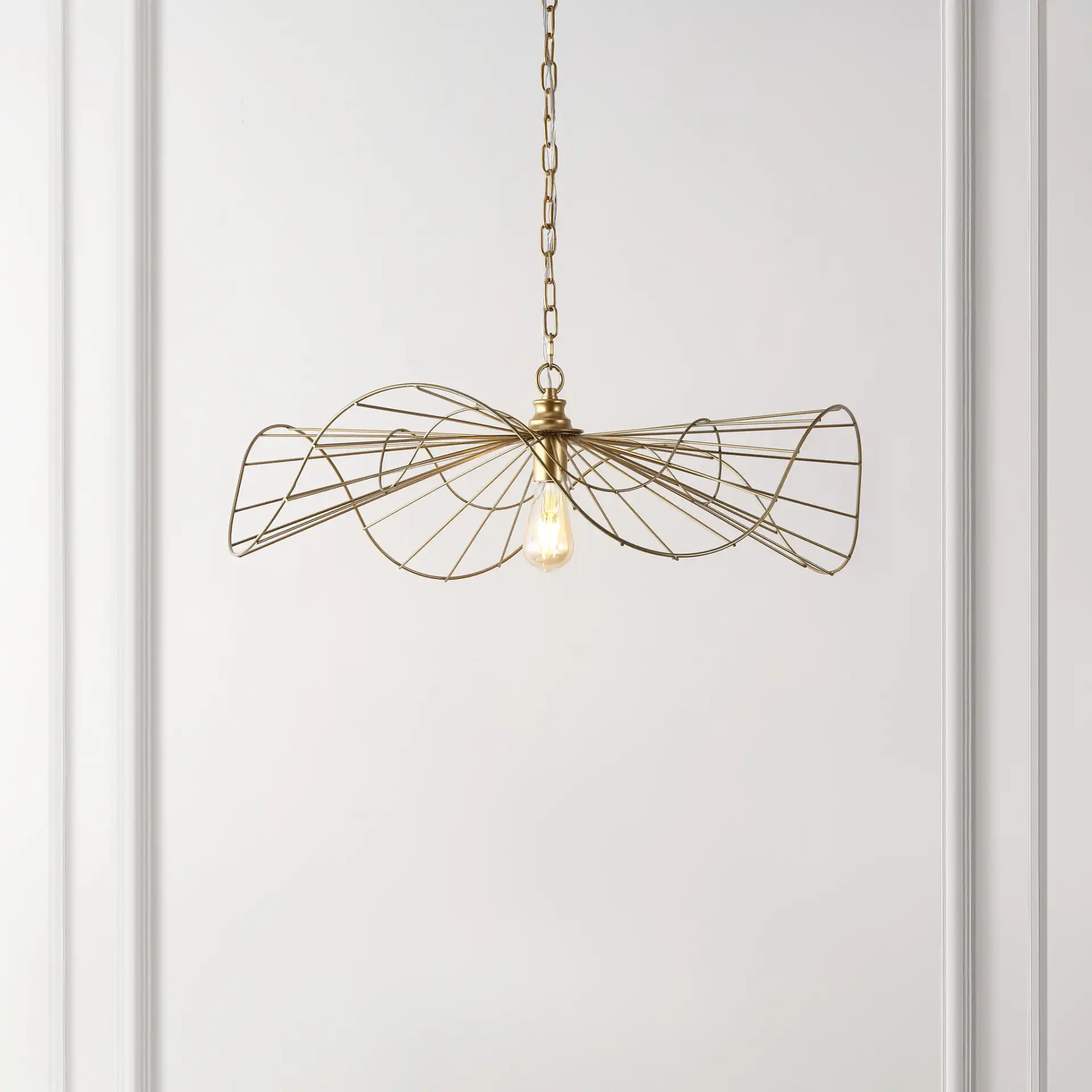 Mikola Pendant in Gold in a styled room