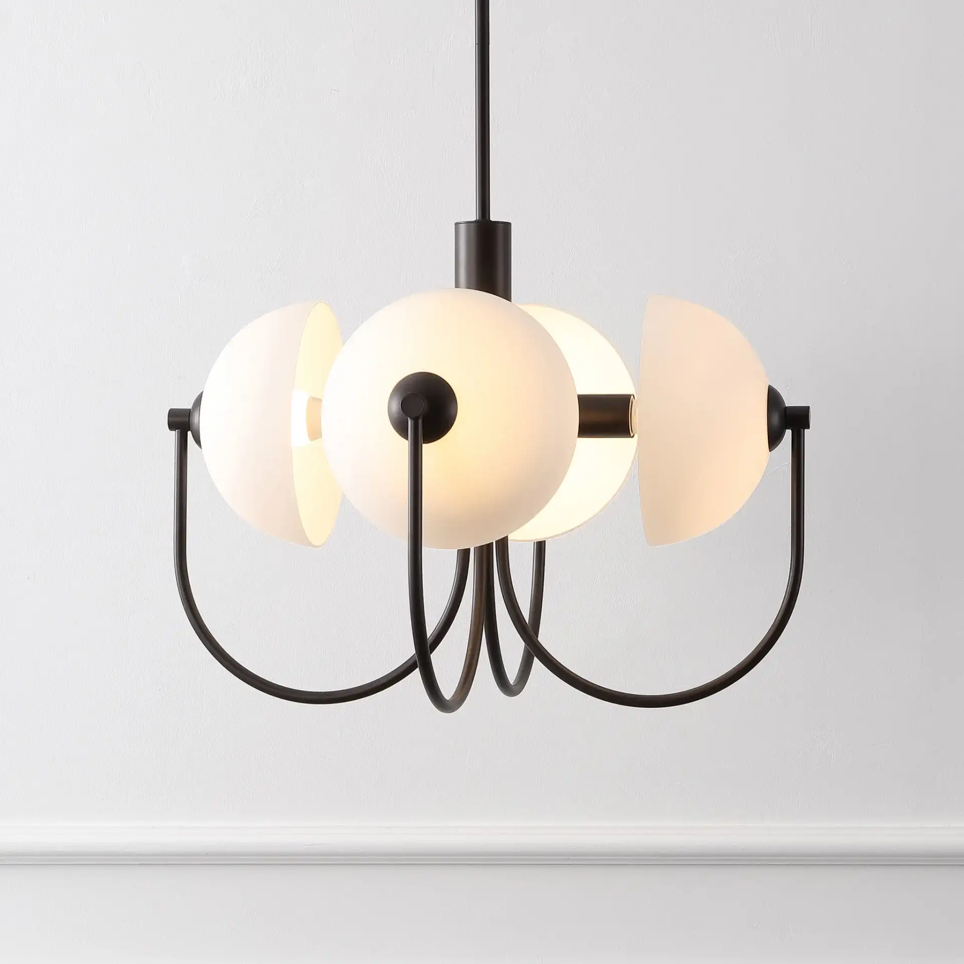 Dreya Four-Light Pendant in Oil Rub Bronze in a styled room