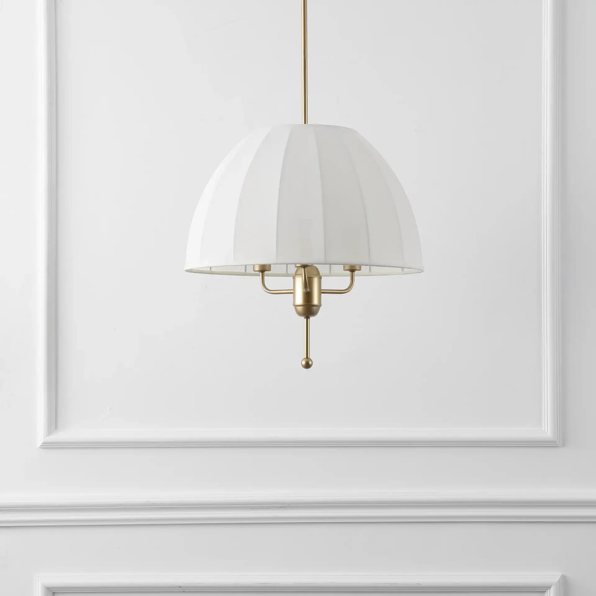 Silvie Three-Light Pendant in Cream / Gold in a styled room