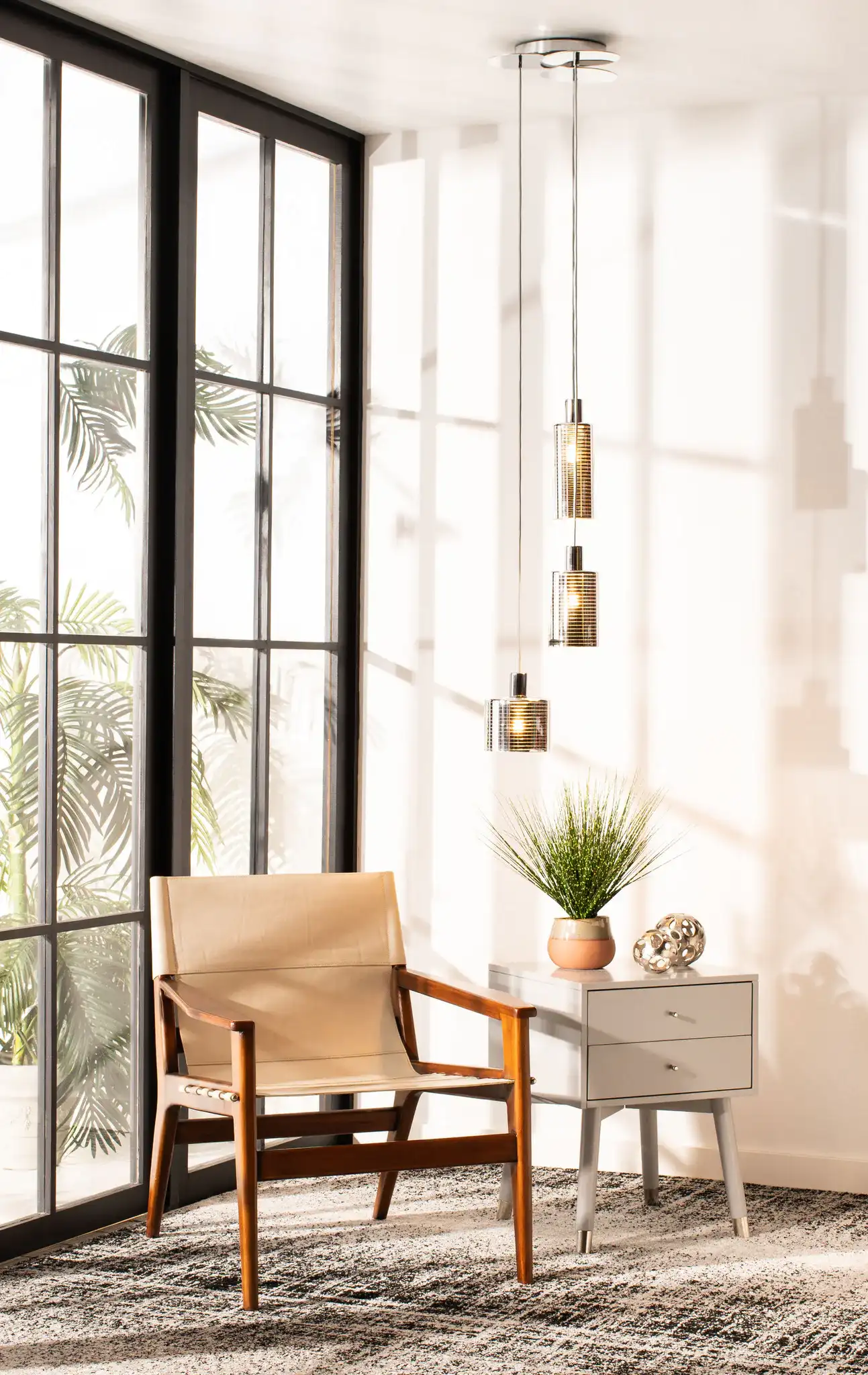 Ranlon Three-Light Pendant in Gray / Light Gray in a styled room