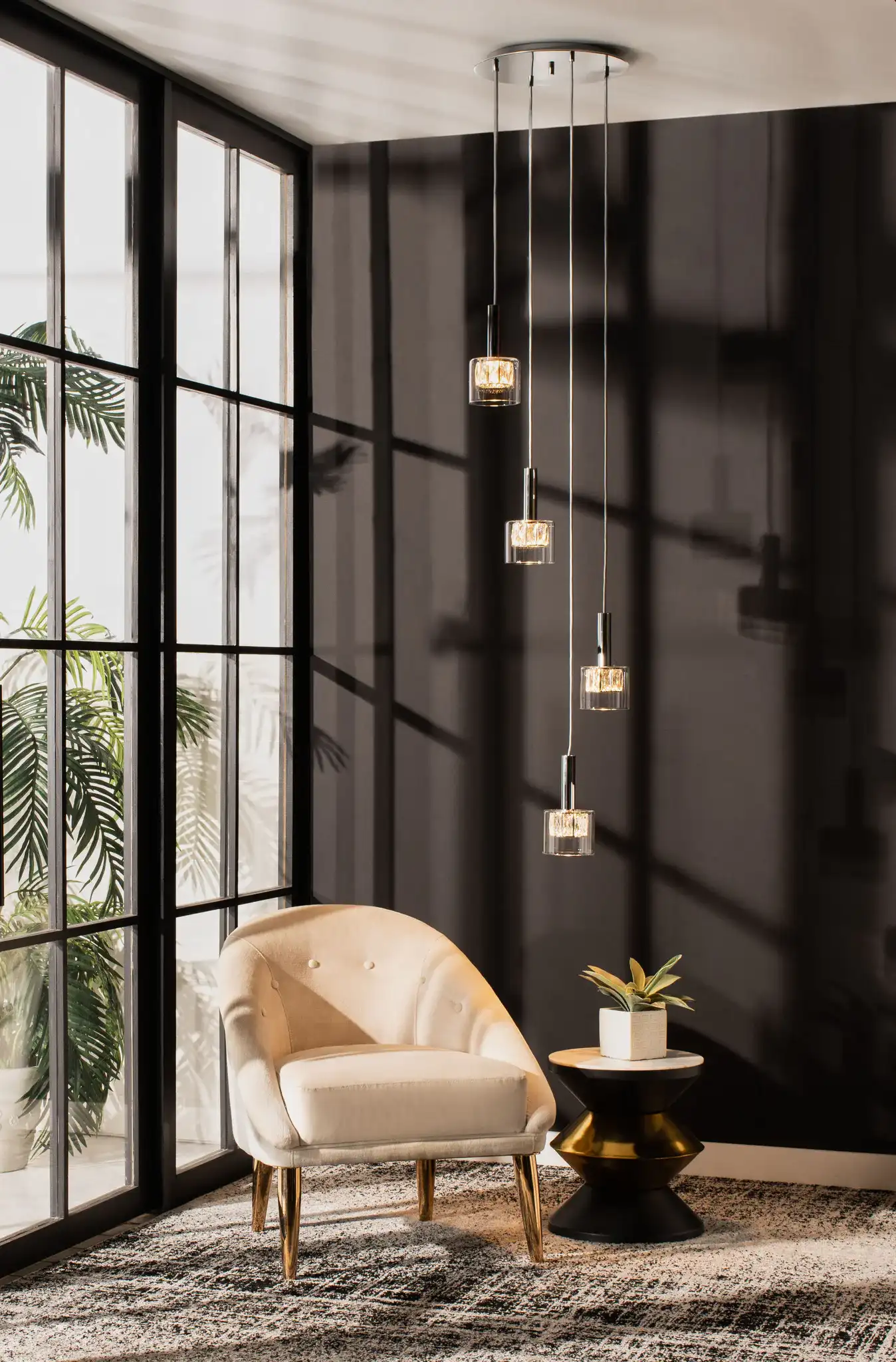 Eban Four-Light Pendant in Silver / Glass in a styled room