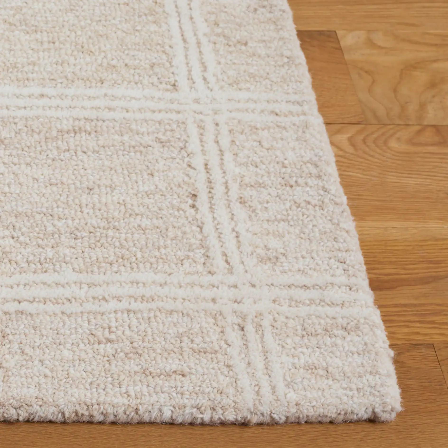 Pine Grid Hand-Tufted Wool Rug in Beige / Ivory in a styled room