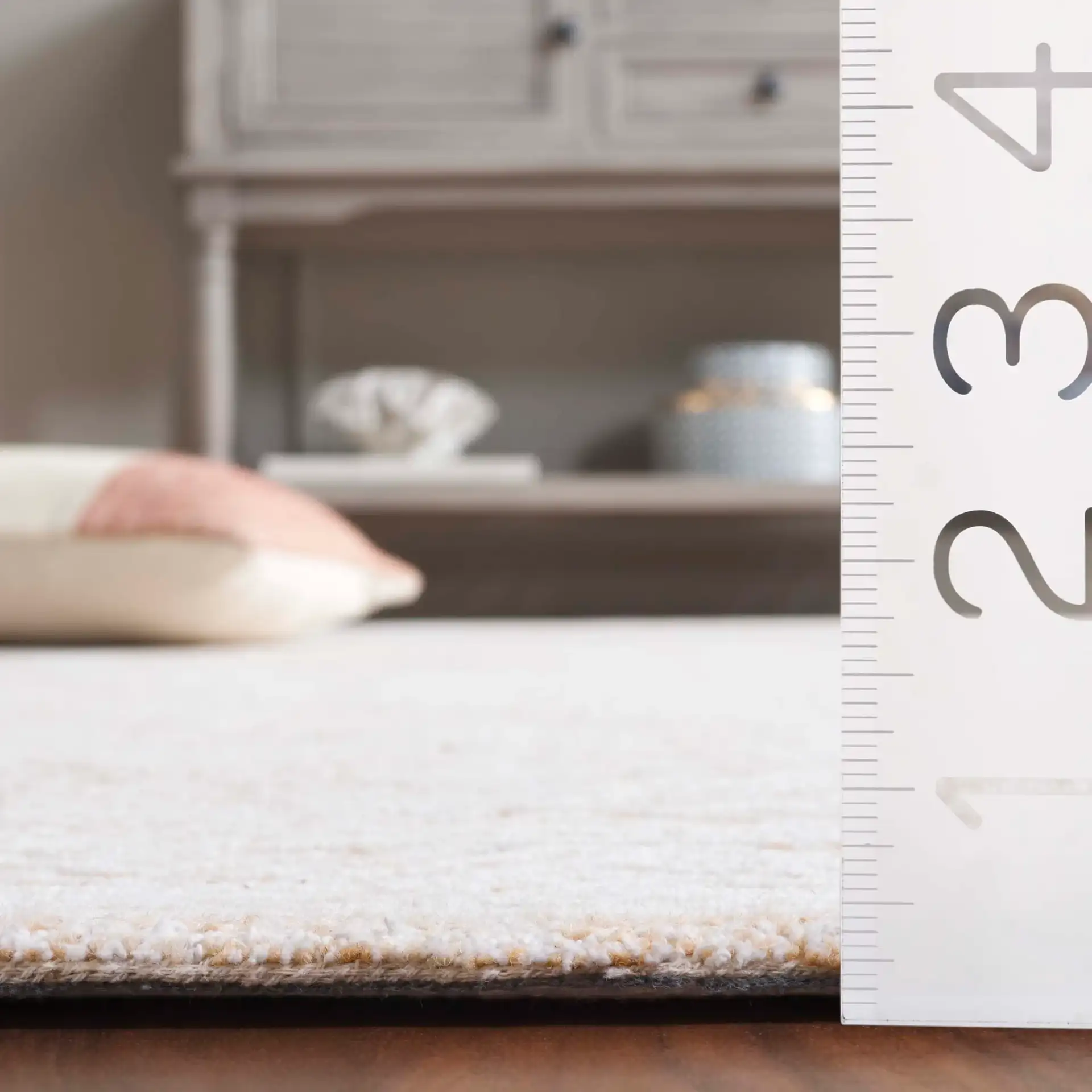 Pine Nested Diamond Hand-Tufted Wool Rug in Ivory / Orange in a styled room