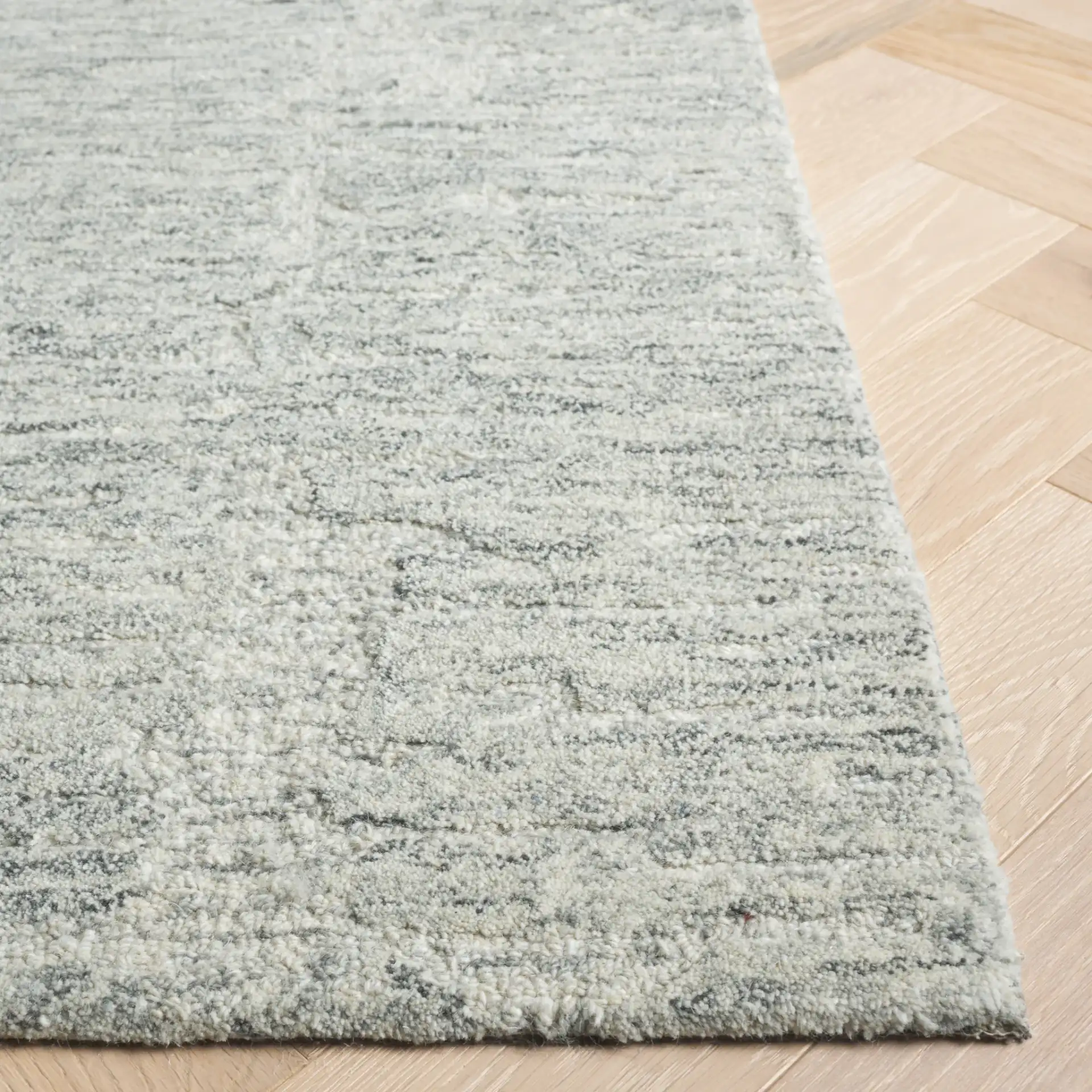 Pine Striated Linear Hand-Tufted Wool Rug in Gray in a styled room