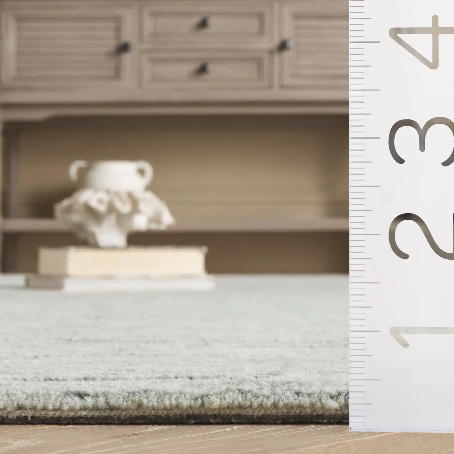 Pine Striated Linear Hand-Tufted Wool Rug in Gray in a styled room