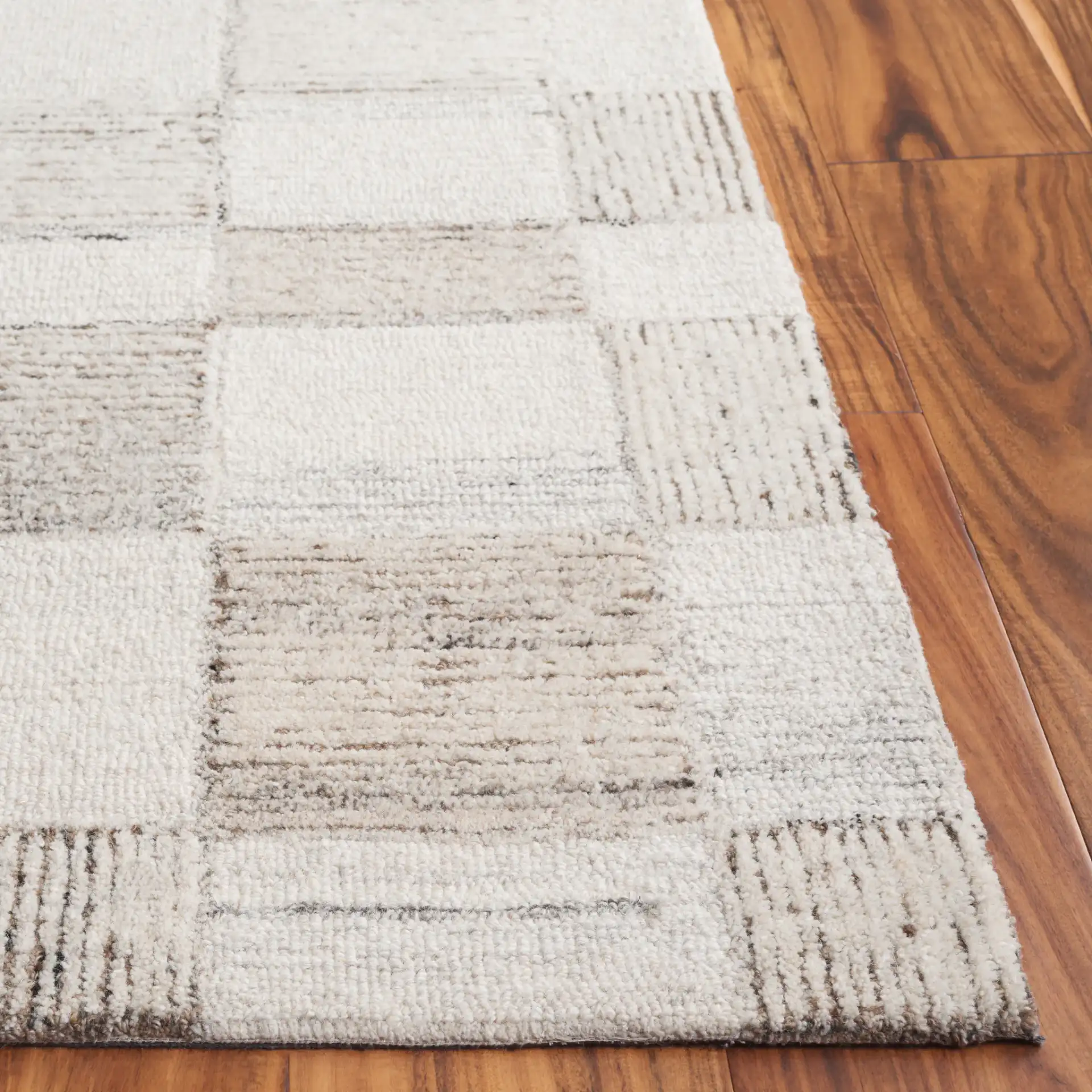 Pine Checkerboard Hand-Tufted Wool Rug in Beige / Brown in a styled room