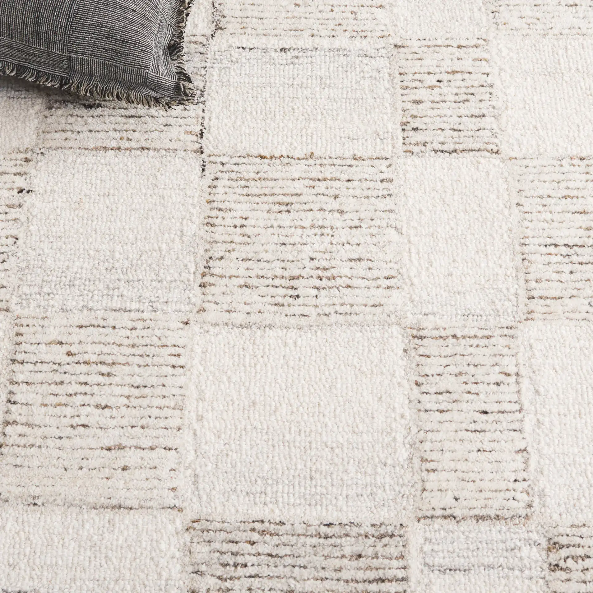 Pine Checkerboard Hand-Tufted Wool Rug in Beige / Brown in a styled room