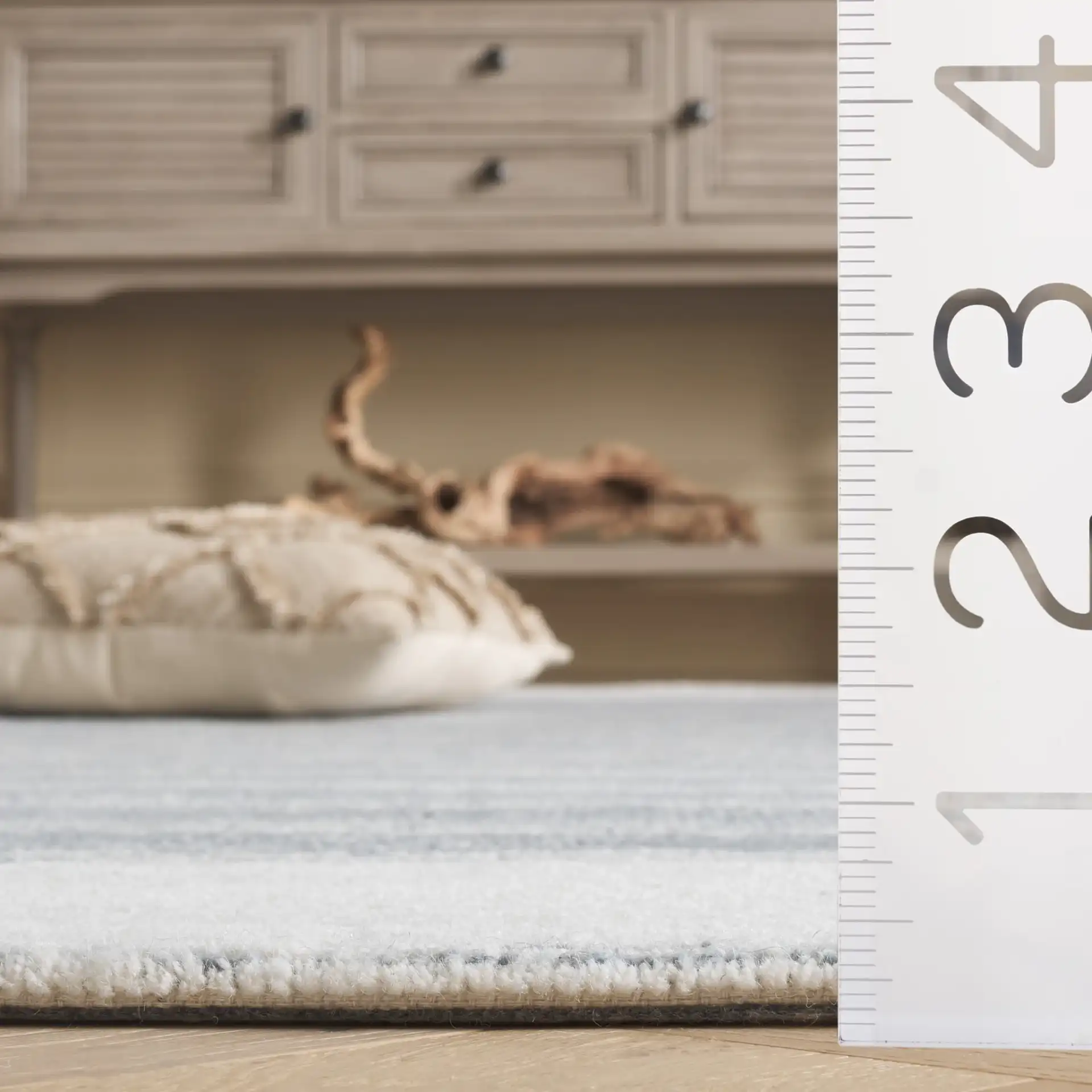 Pine Bordered Stripe Hand-Tufted Wool Rug in Blue / Ivory in a styled room