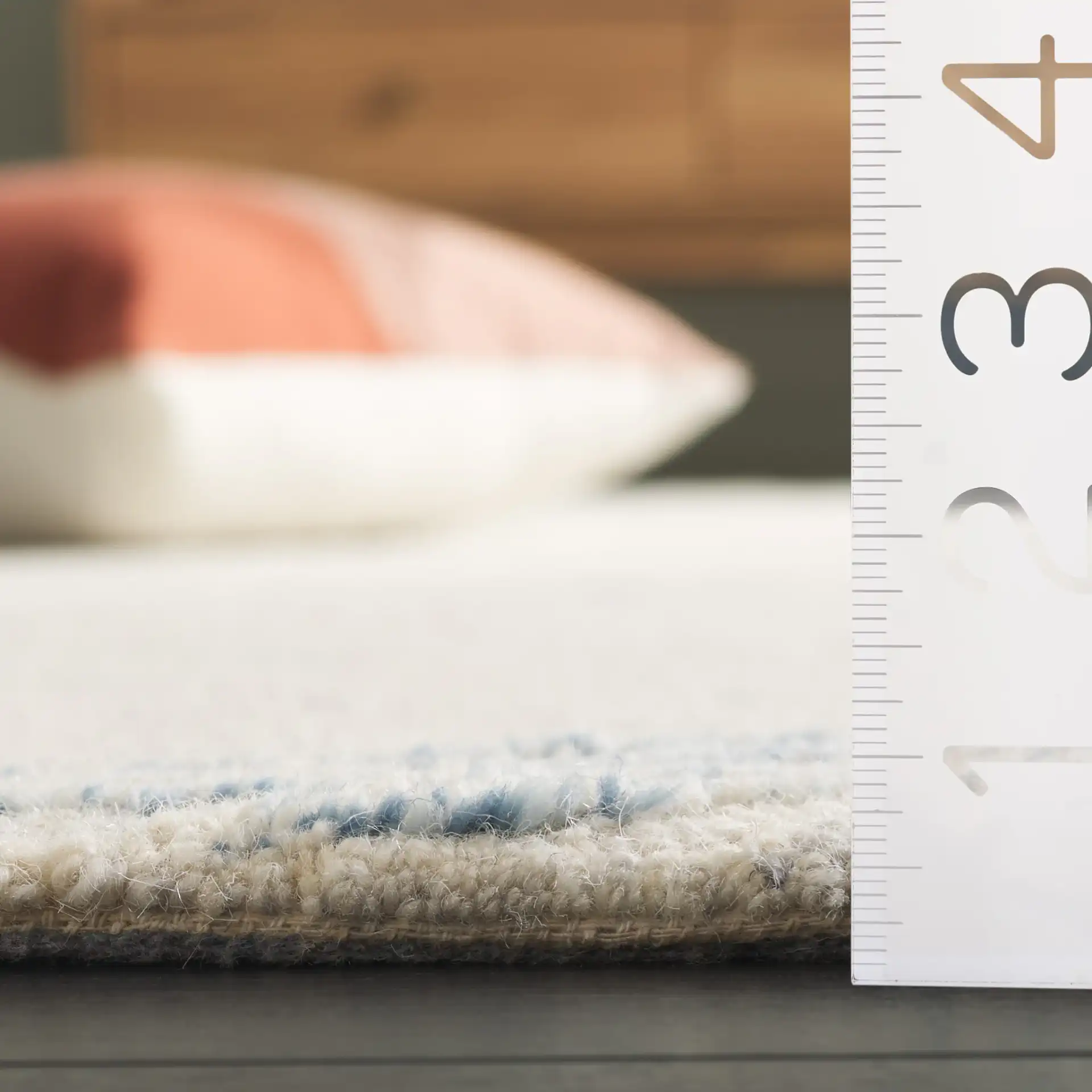 Pine Concentric Arc Hand-Tufted Wool Rug in Light Gray / Ivory in a styled room