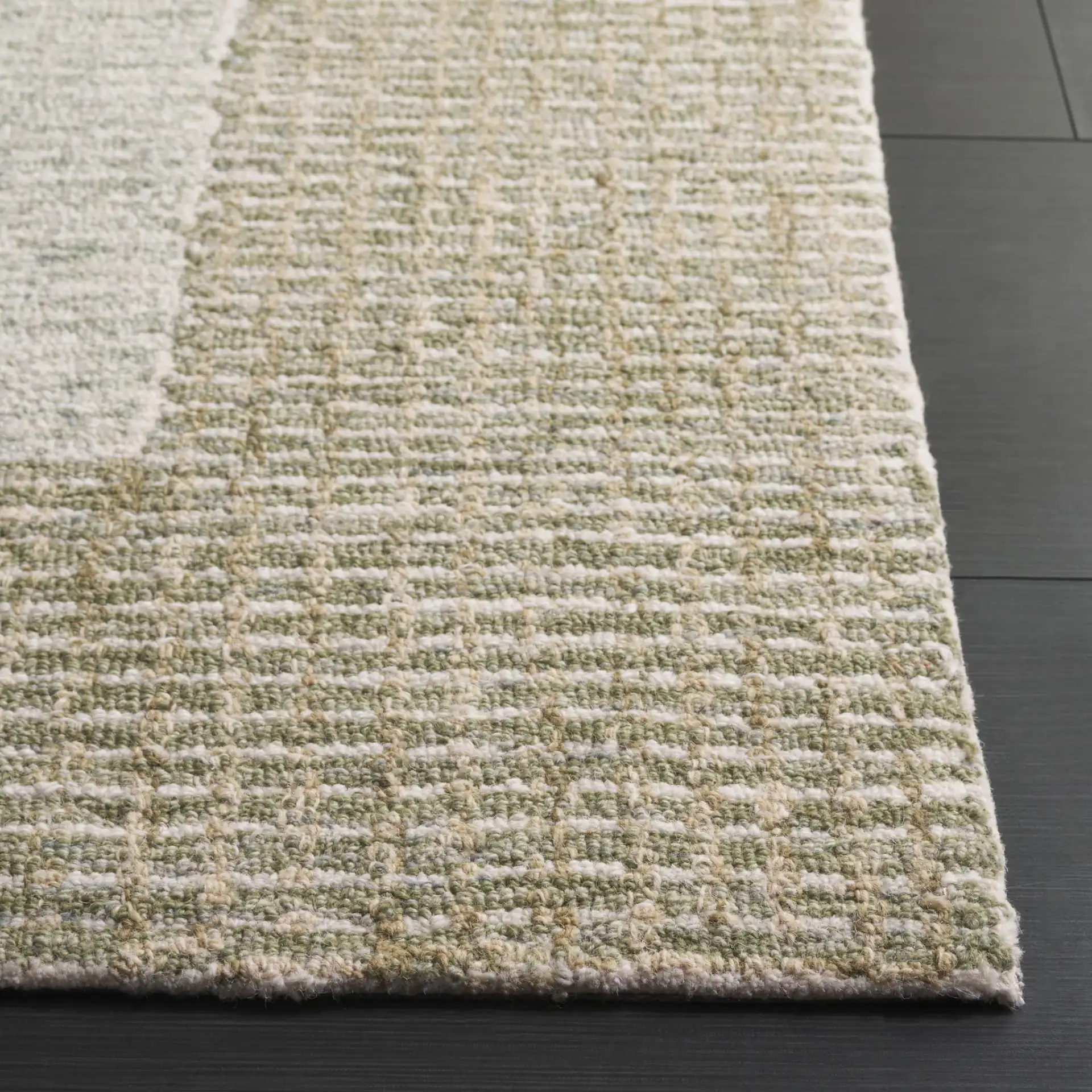 Pine Concentric Border Hand-Tufted Wool Rug in Green / Ivory in a styled room