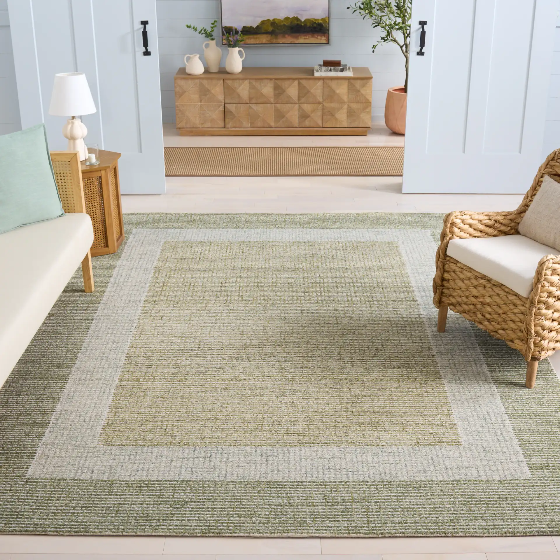 Pine Concentric Border Hand-Tufted Wool Rug in Green / Ivory in a styled room